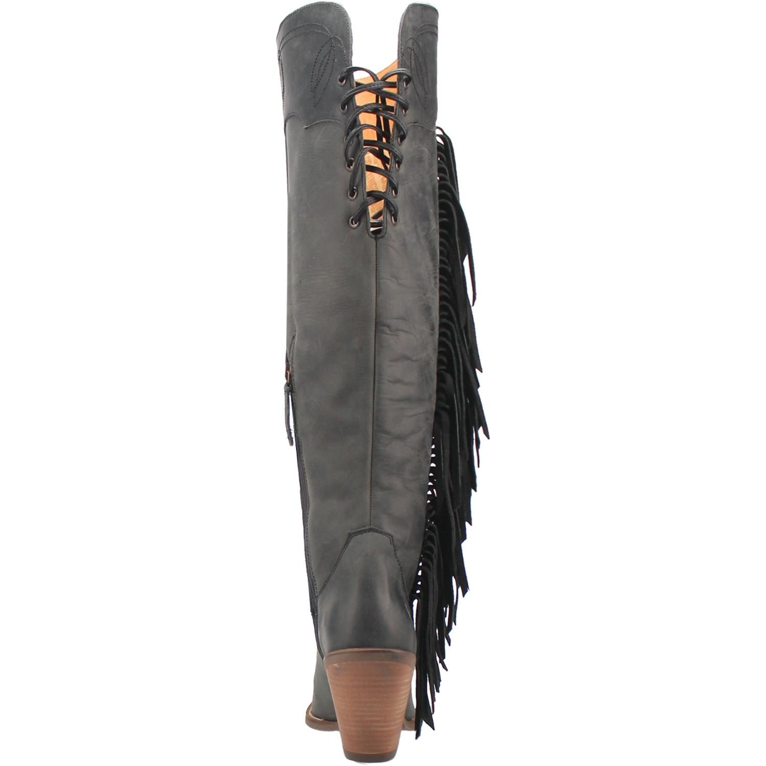 A tall black leather boot with a short heel, stitched desings at the top and bottom, lace up back, fringe down the right side, and a half zipper. Item is pictured on a plain white background