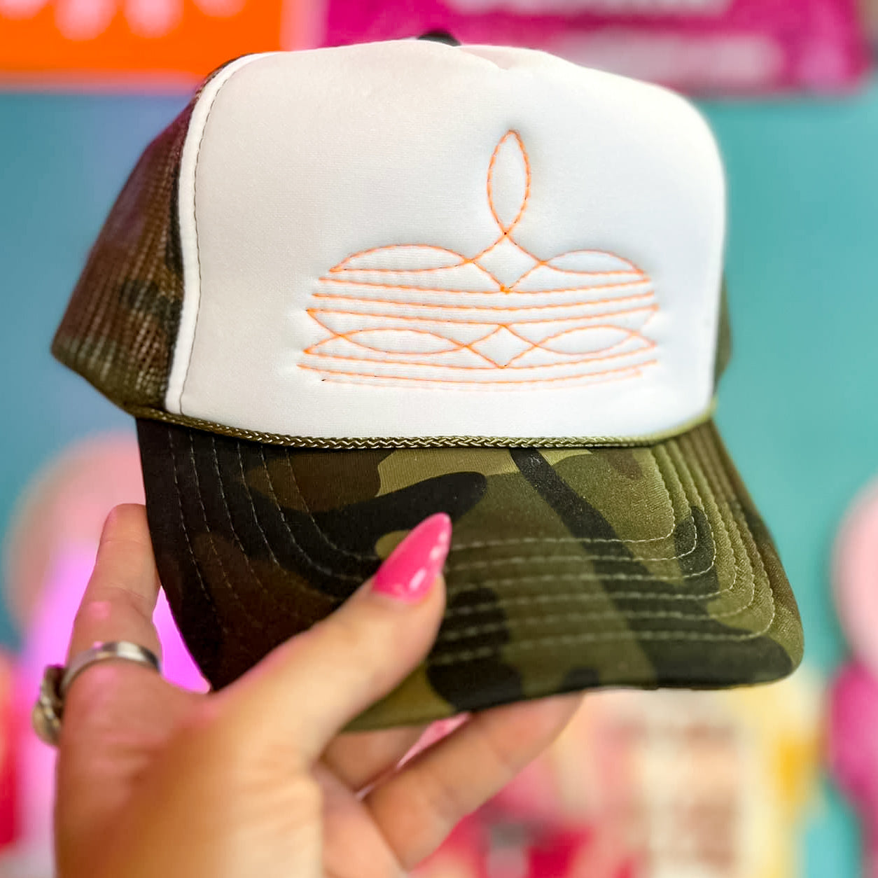 Online Exclusive | Orange Boot Stitch Foam Trucker Cap in Camo and White - Giddy Up Glamour Boutique