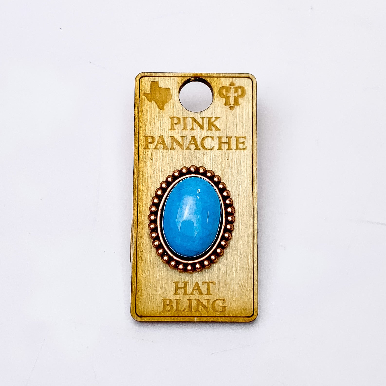 Pink Panache | Rose Gold Tone Oval Hat Pin with Turquoise Cabochon Stone. Pictured on a white background.