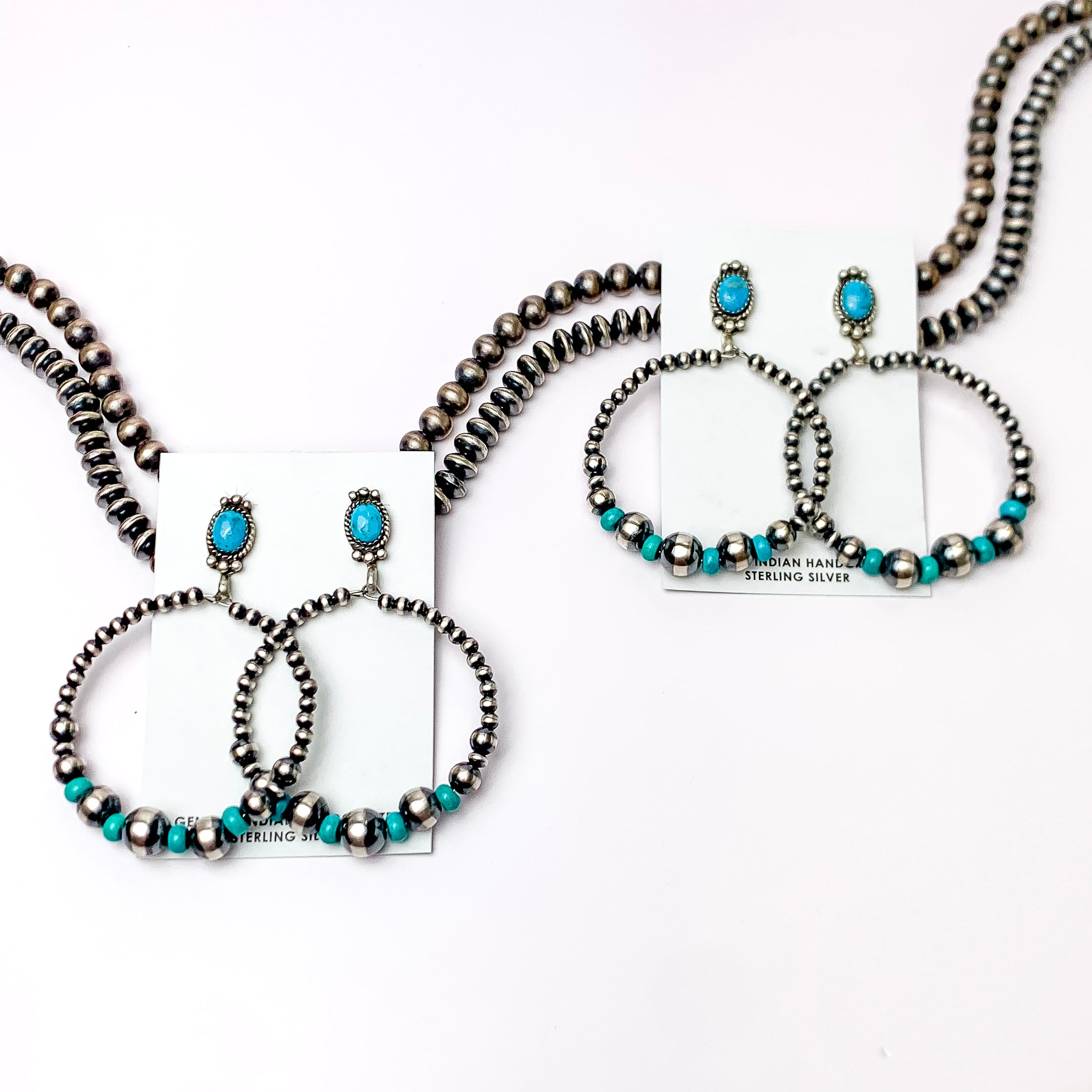 In the picture are Navajo hoop earrings with turquoise pearl studs on top. 