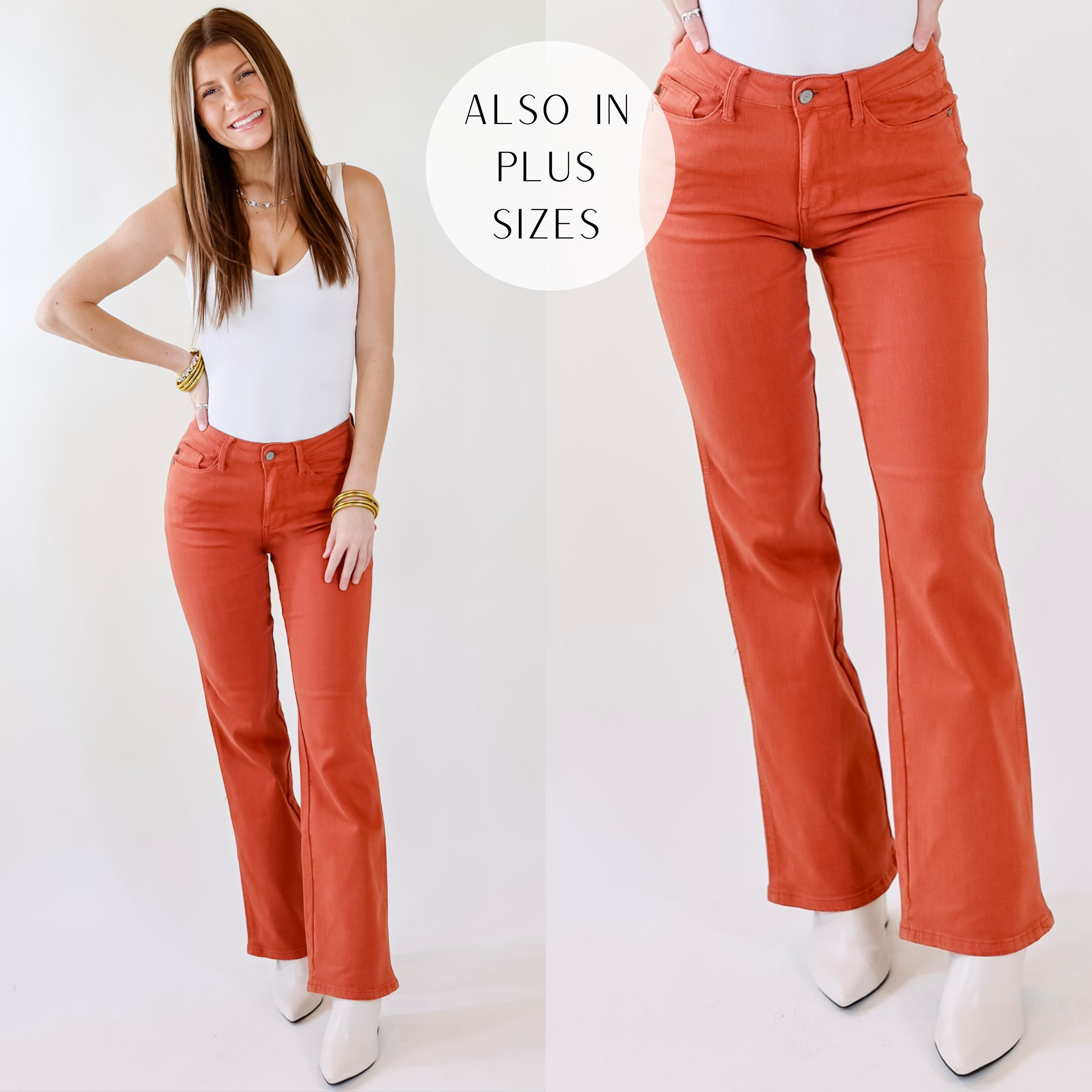 Model is wearing a pair if rust orange bootcut jeans. Model has these jeans paired with a white tank top, white booties, and gold jewelry.