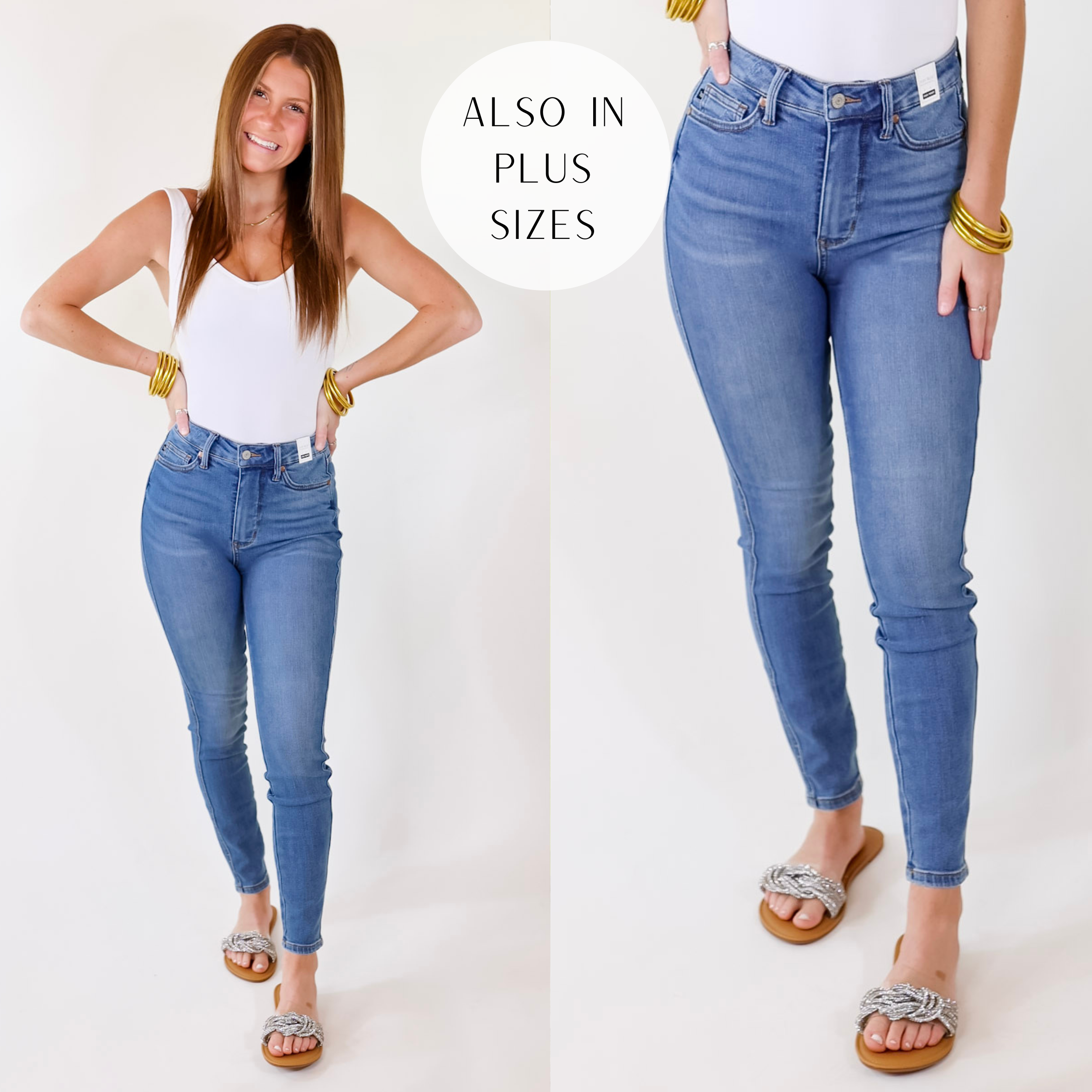 Model is wearing a pair of high waist skinny jeans in a medium wash. Model has these jeans paired with a white tank top, crystal sandals, and gold tone jewelry.