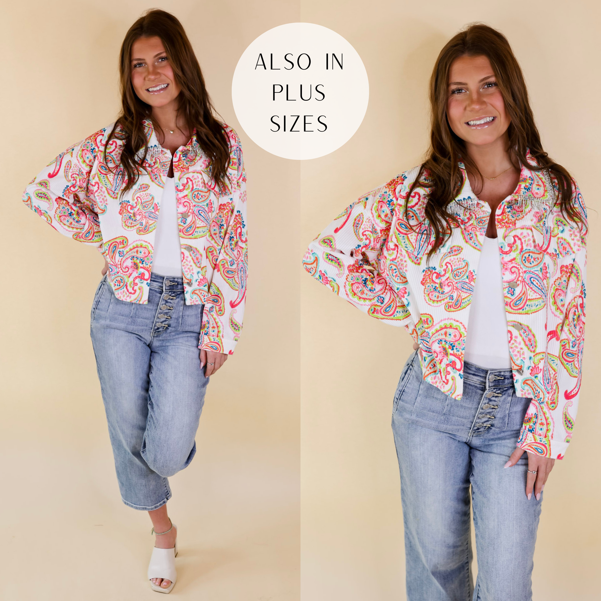 Model is wearing a button up jacket with crystal fringe around the collar and a neon green, pink, and blue paisley print. Model has this jacket on over a white tank top, cropped jeans, ivory heels, and gold jewelry.