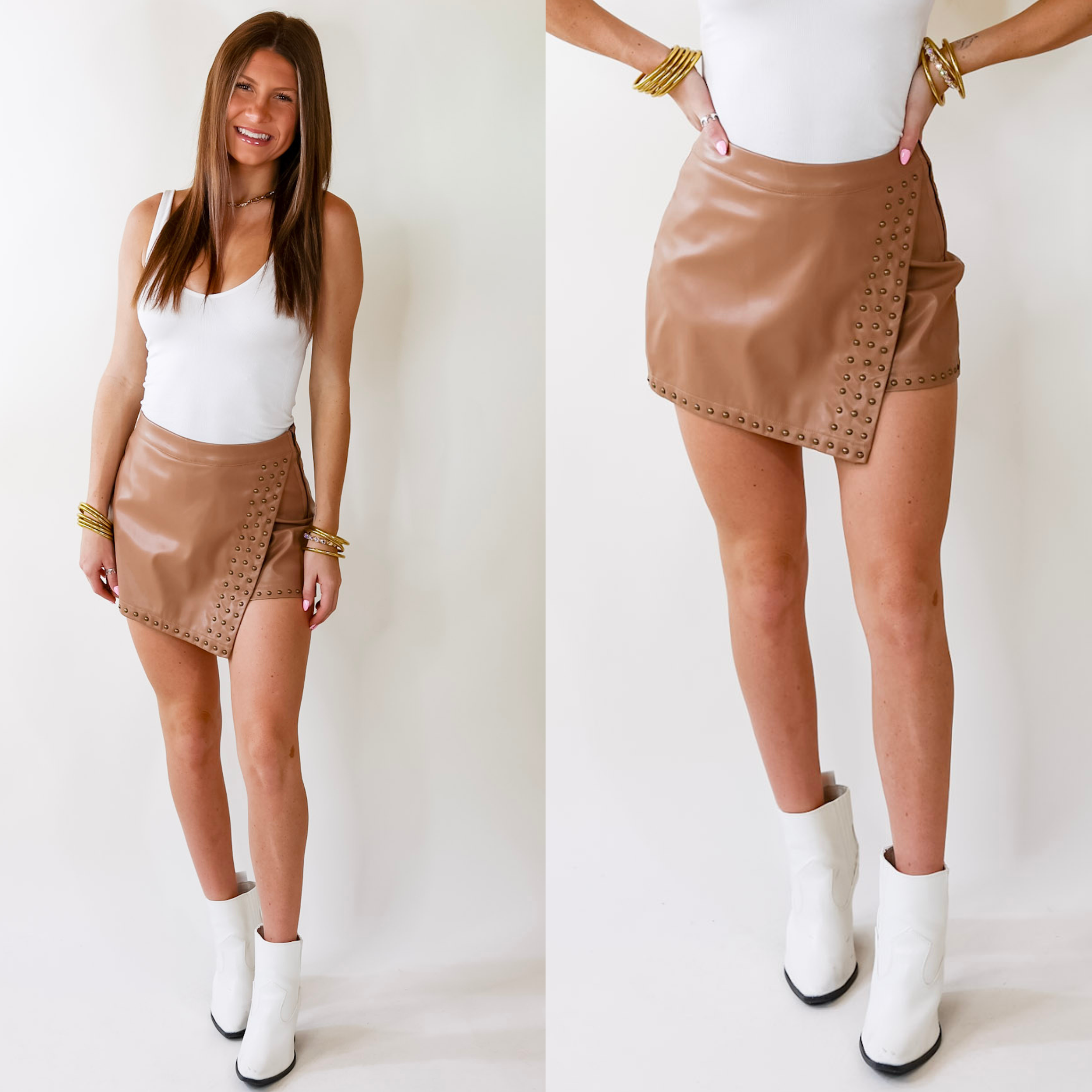 Model is wearing a pair of tan pleather shorts with a silver tone studded trim. Model has paired the shorts with a white bodysuit, white booties, and gold jewelry.