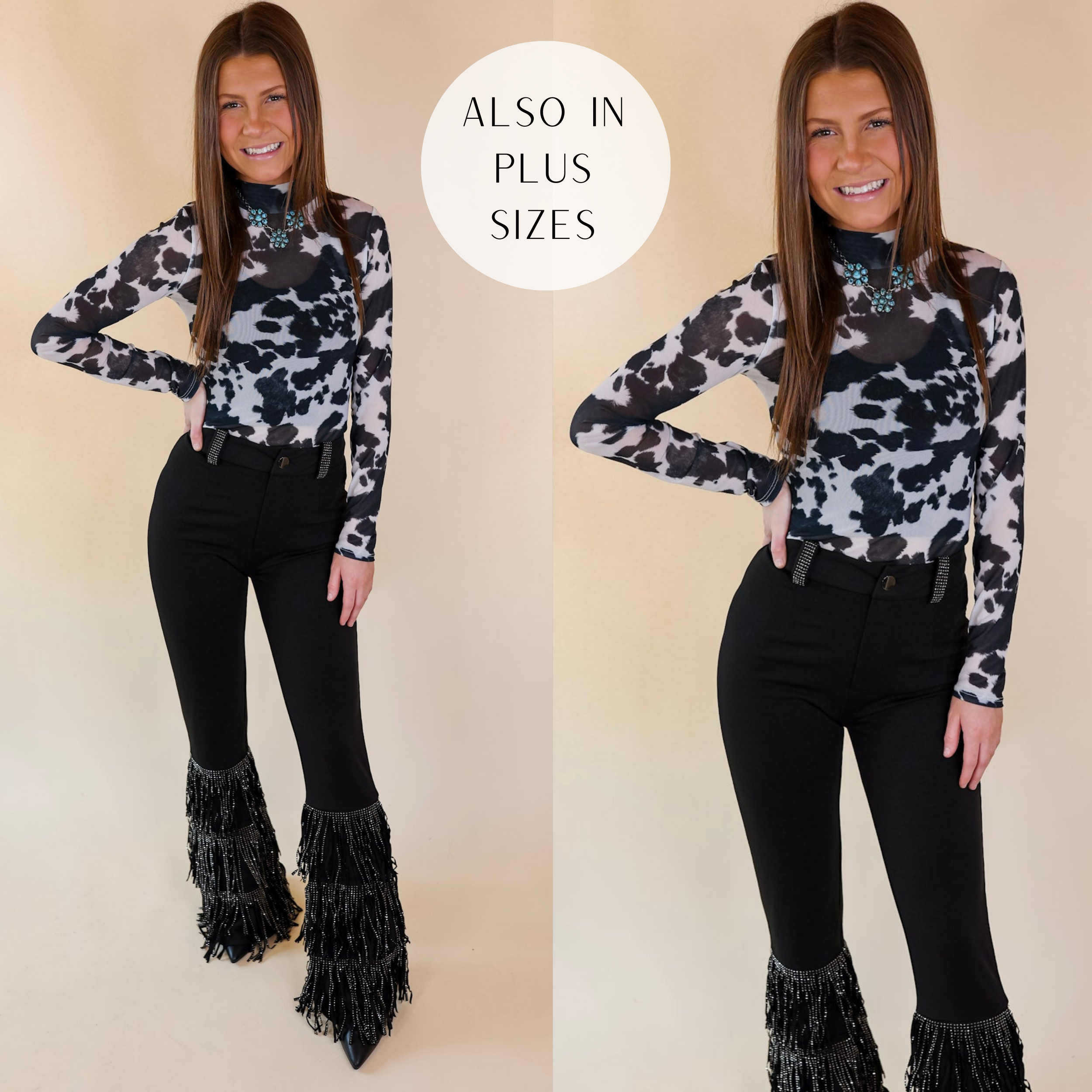 Model is wearing a long sleeve bodysuit that is a black and white cow print. Model has this long sleeve bodysuit paired with black bell bottom pants, black boots, and turquoise jewelry.