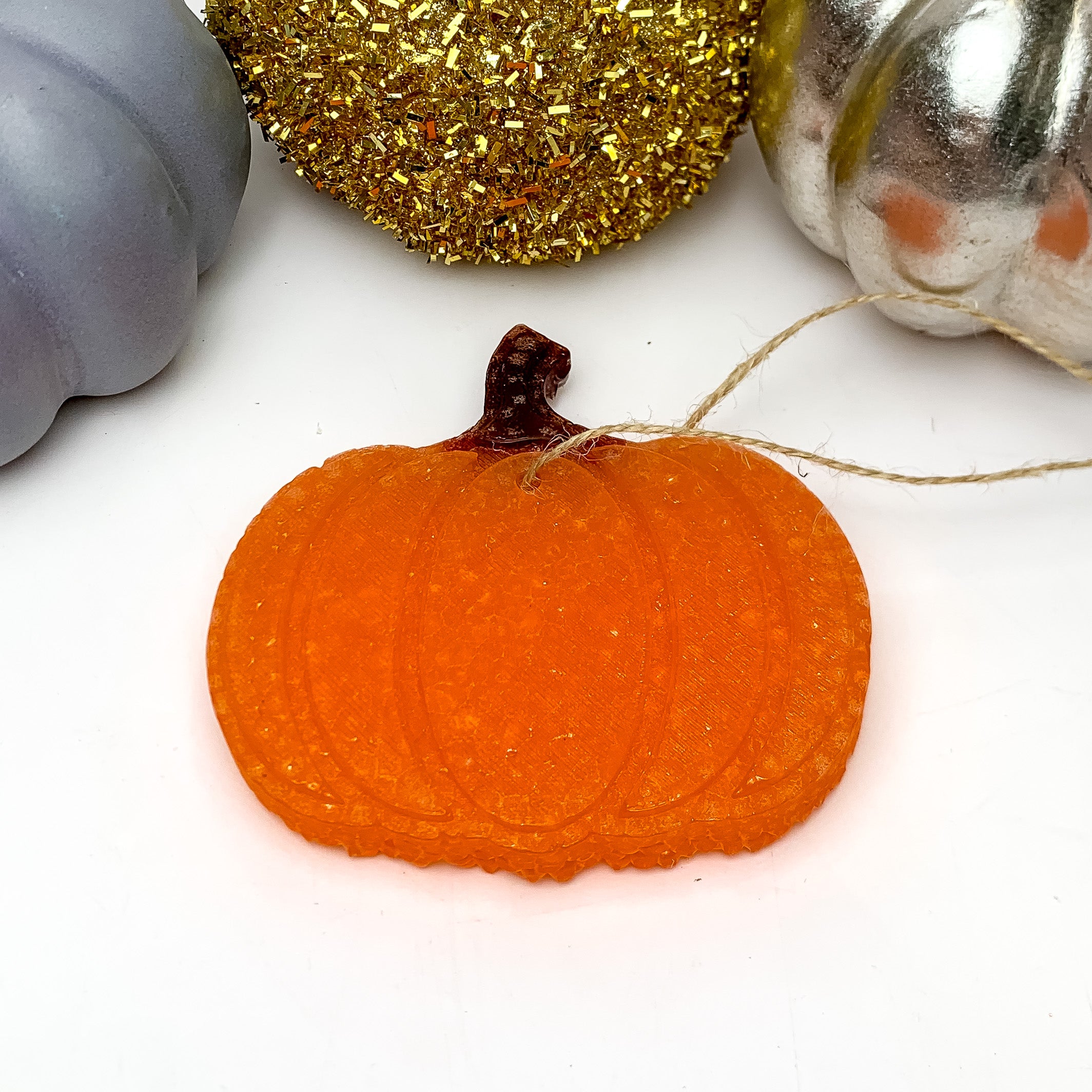 Two Toned Pumpkin Freshie in Pumpkin Souffle. This pumpkin freshie on a white background with decorative pumpkins above it.
