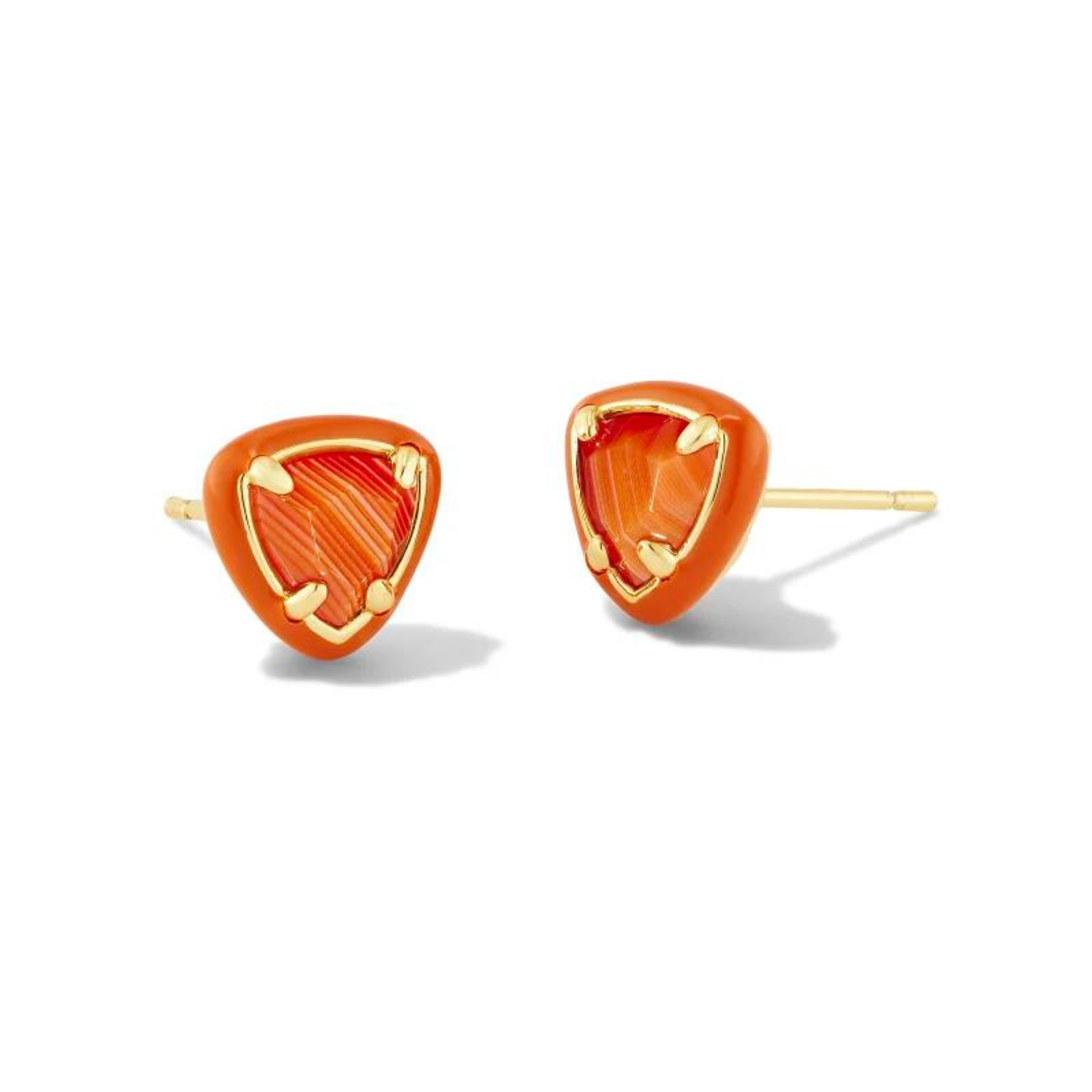 Orange framed, triangle shaped stud earrings with a center orange stone and a gold ear post. These earrings are pictured on a white background.