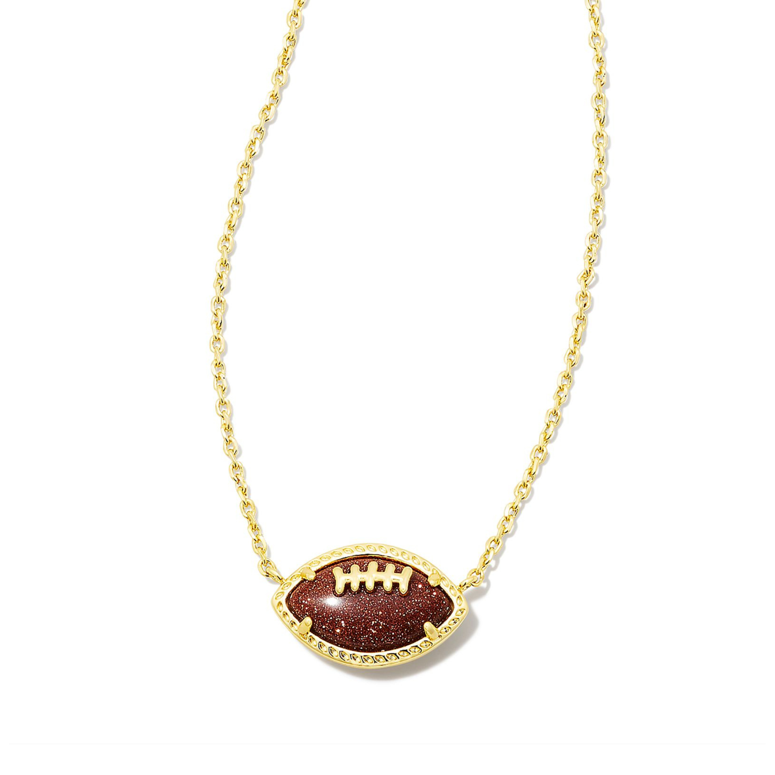 Gold chain necklace with brown football pendant pictured on a white background. 