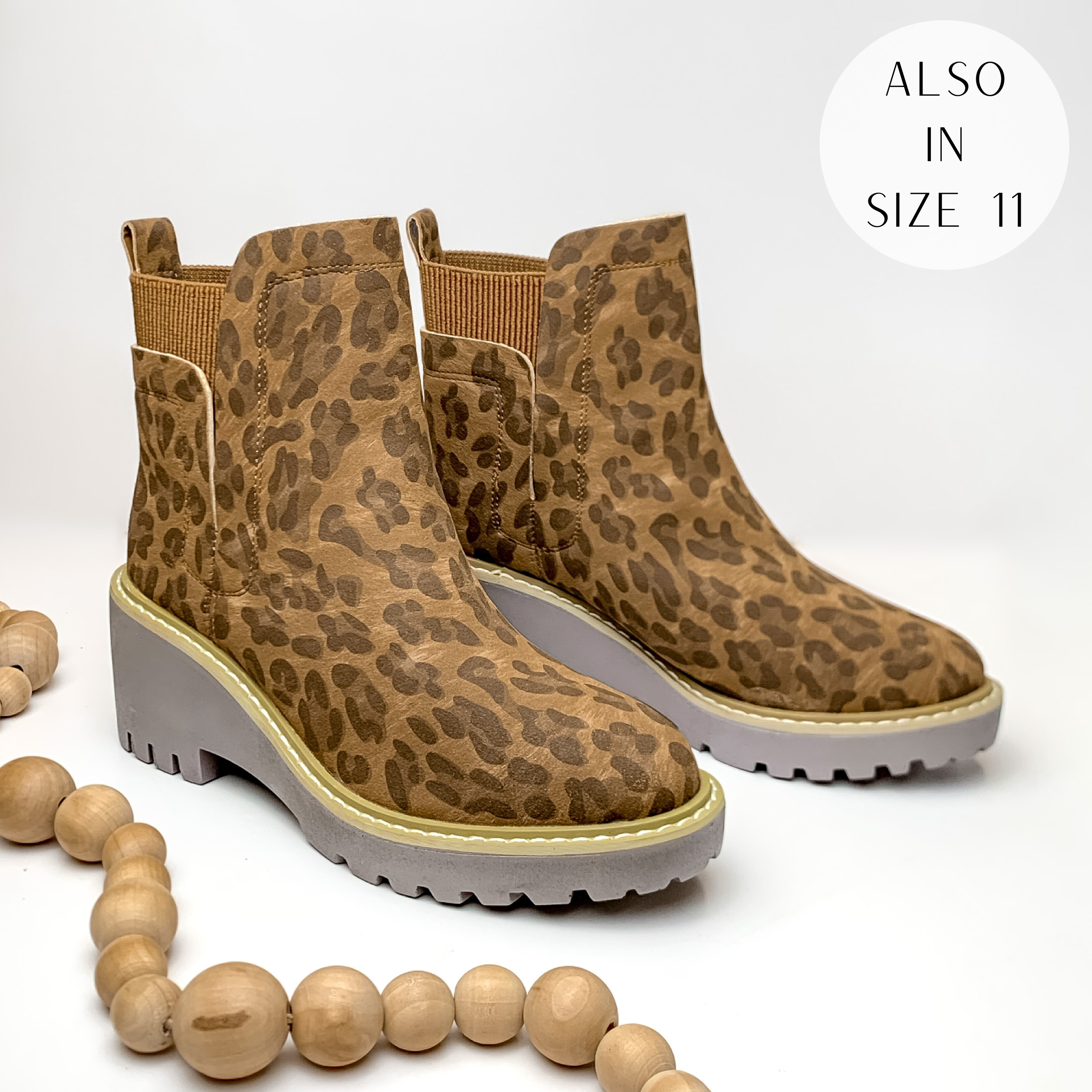 Leopard print pull on booties with chunky heel. Pictured on white background with light tan beads.
