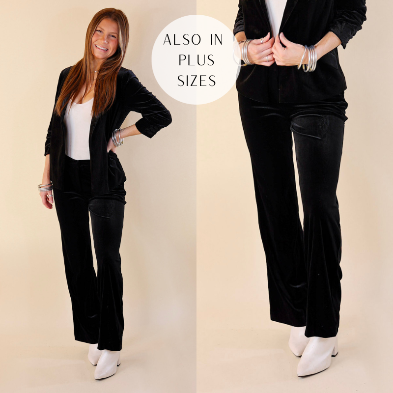 Velvet black outfit. The trousers have a belt loop and zipper. The model is wearing this outfit with gold jewelry and white booties
