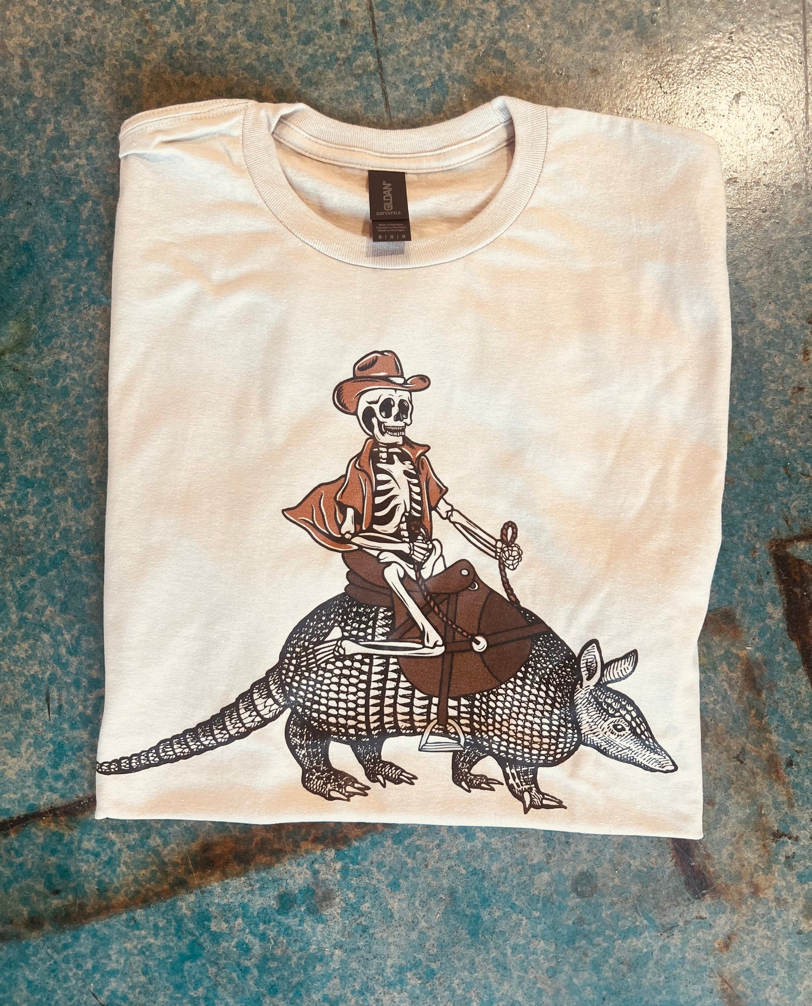Online Exclusive | Skeleton on Armadillo Short Sleeve Graphic Tee in Cream - Giddy Up Glamour Boutique