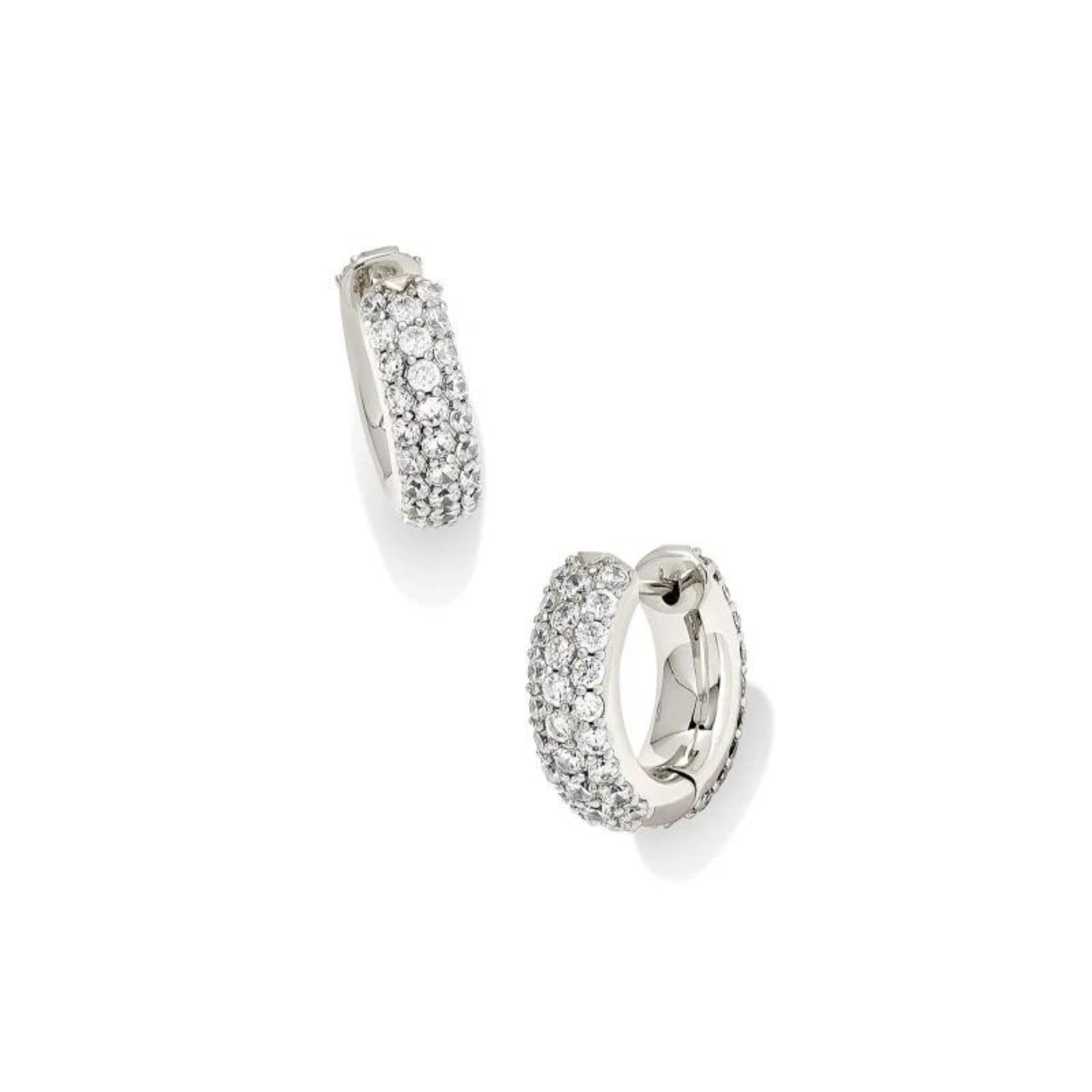 Silver crystal huggie earrings, pictured on a white background.