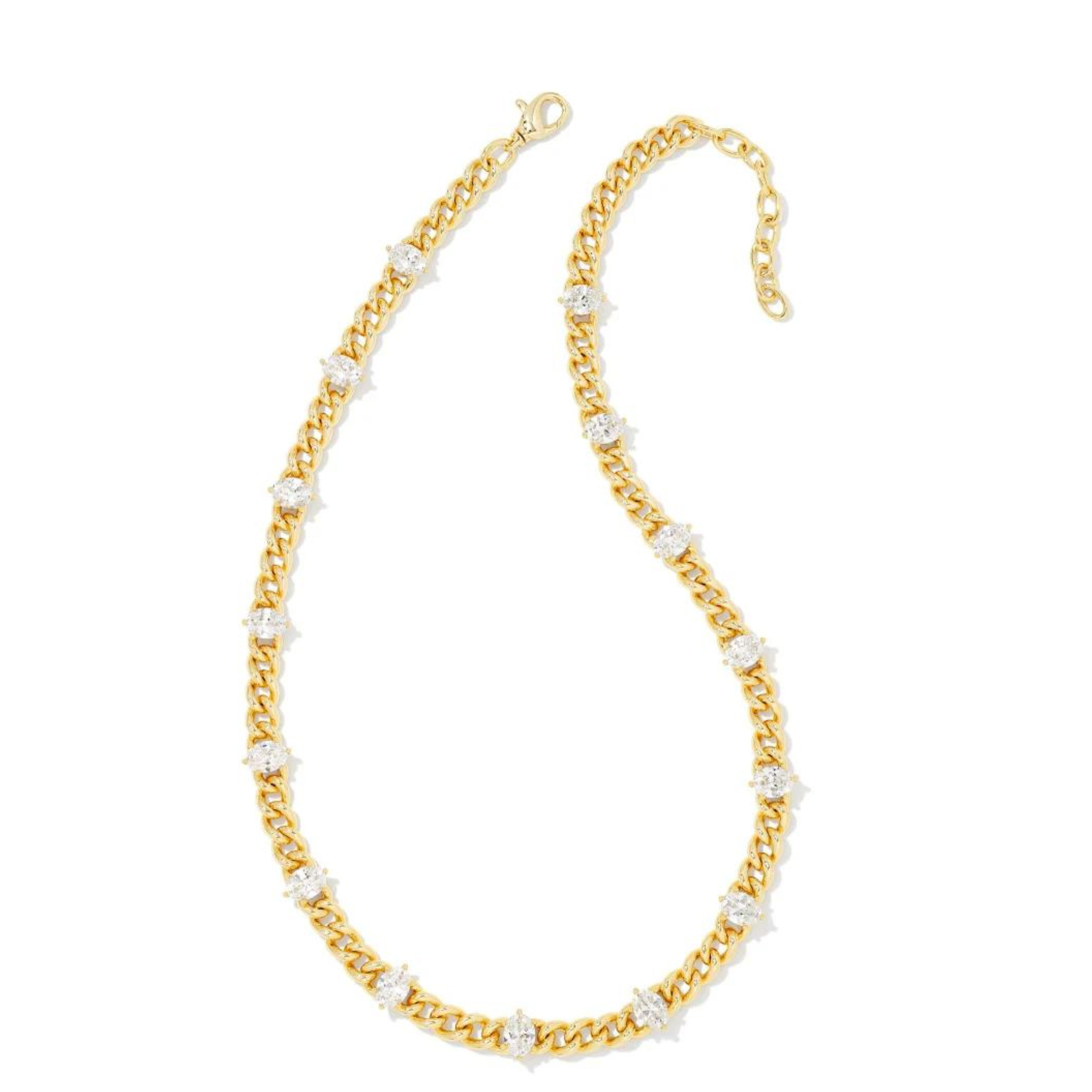 Gold chain necklace with white crystals, pictured on a white background.