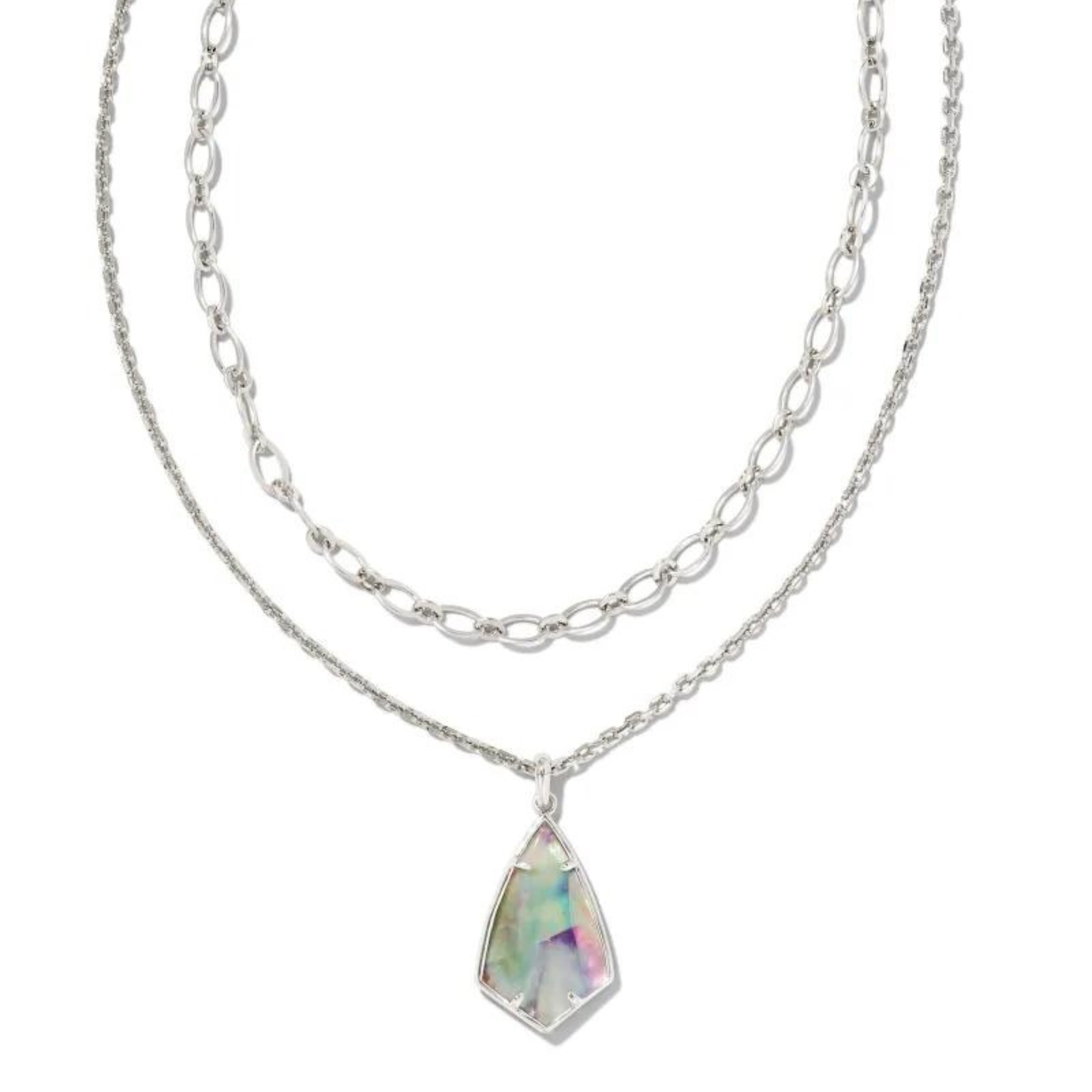 Silver multi strand necklace with a lilac abalone pendant, pictured on a white background.