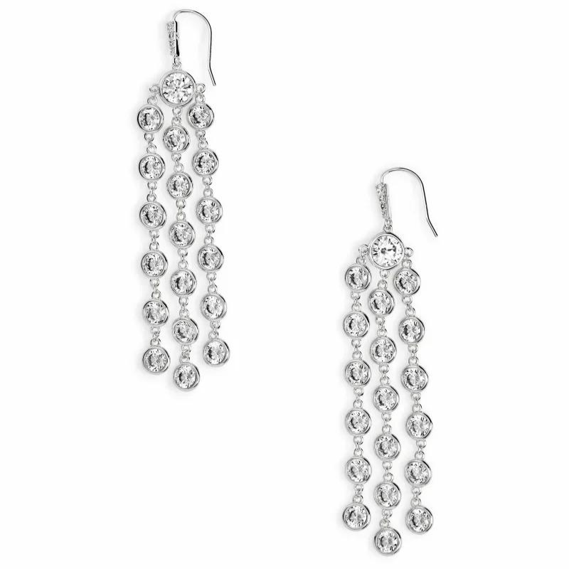 Silver dangle earrings with white crystal circles creating a waterfall shape earring, pictured on a white background