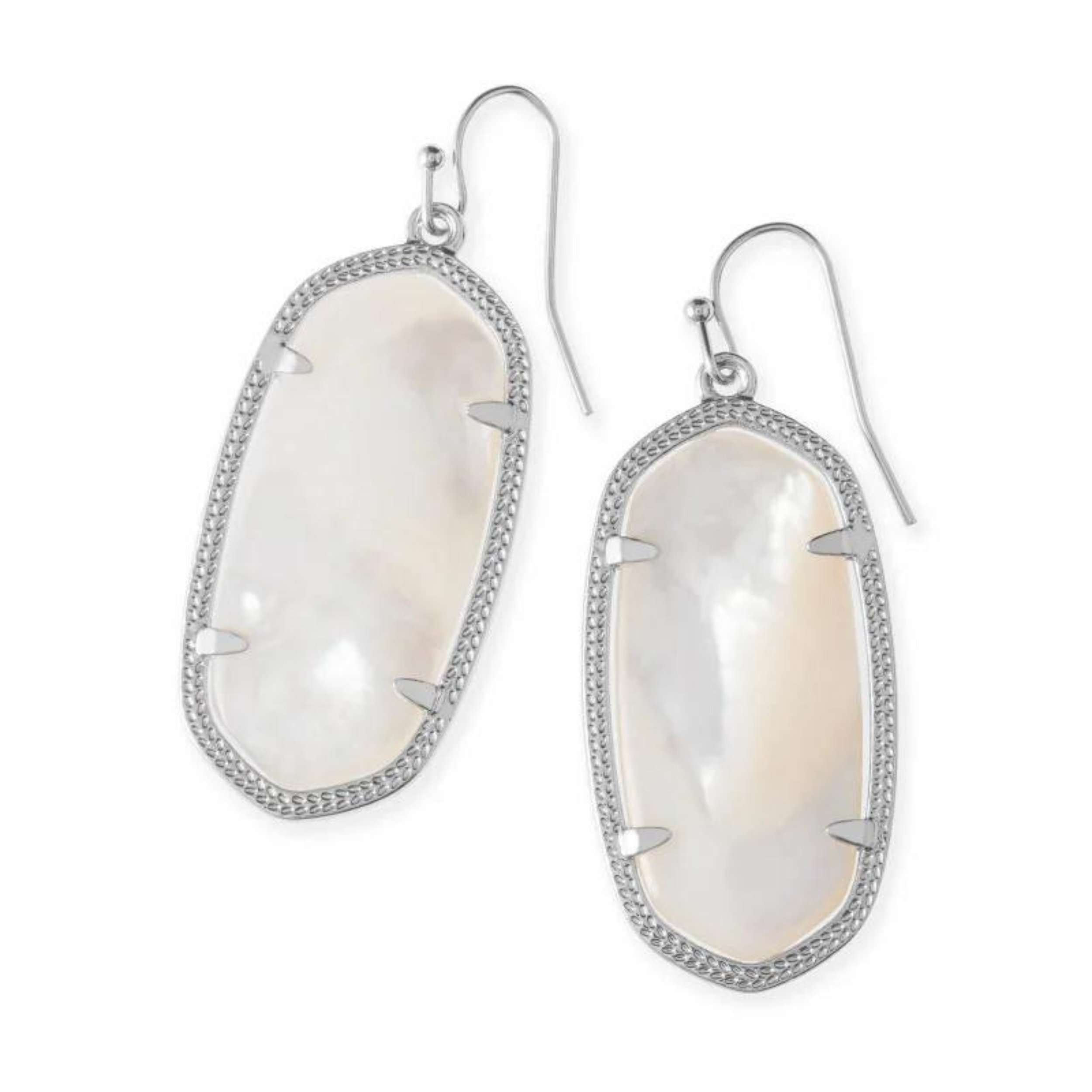 Silver drop dangle earrings with ivory pearl stone centers pictured on a white background.