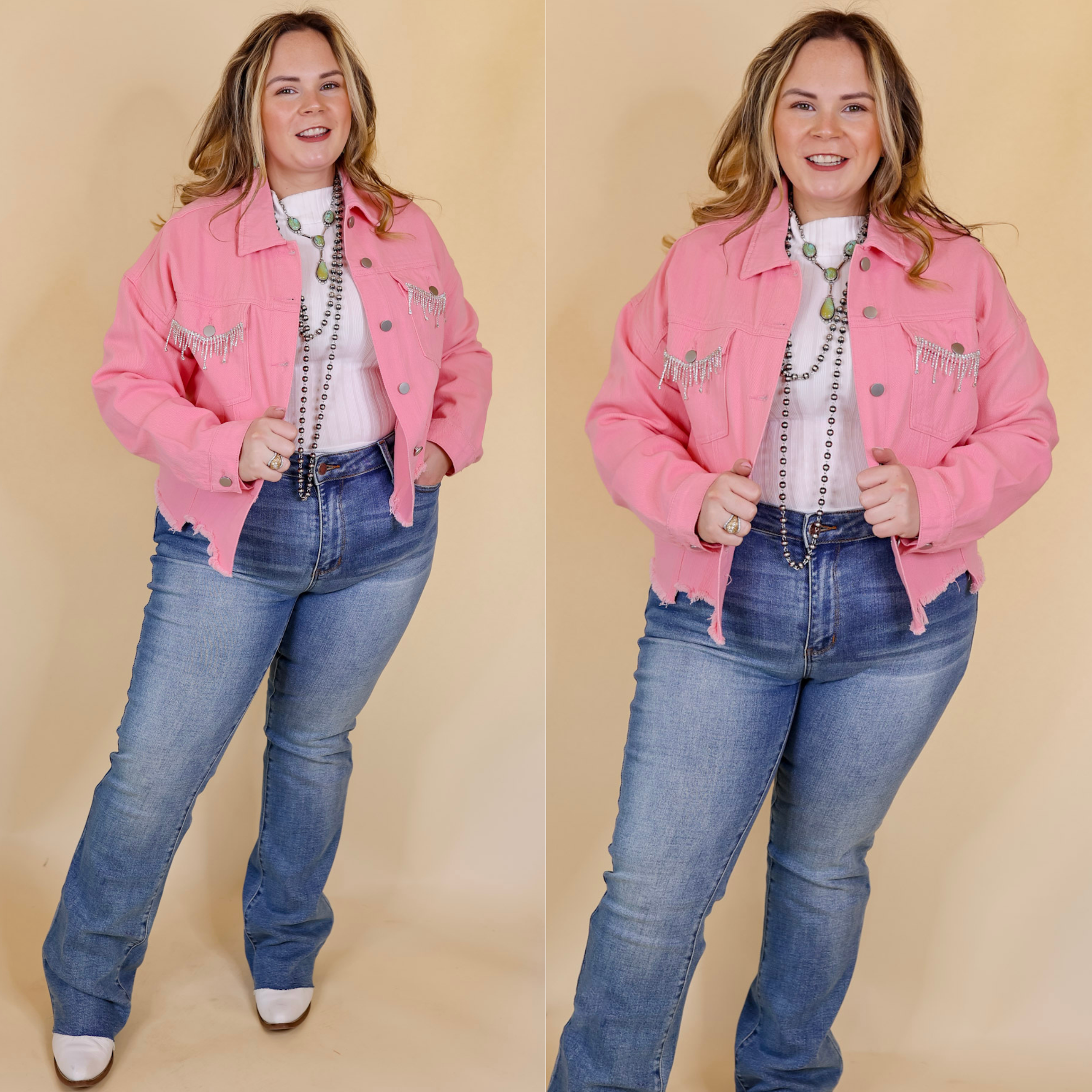 Model is wearing a denim jacket with crystal fringe around the pocket, in light pink. Model has this jacket paired with a white top, jeans, white booties, and silver jewelry. The background is solid tan. 
