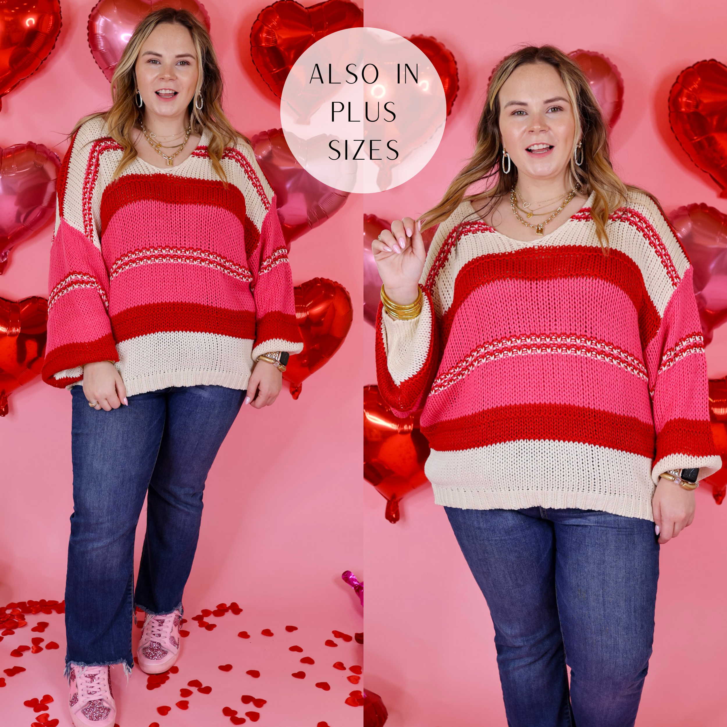 Model is wearing a long sleeve v neck striped sweater in red, white, and pink. Model has this sweater paid with straight leg jeans, sneakers, and gold jewelry. Background is light pink with red heart balloons.  
