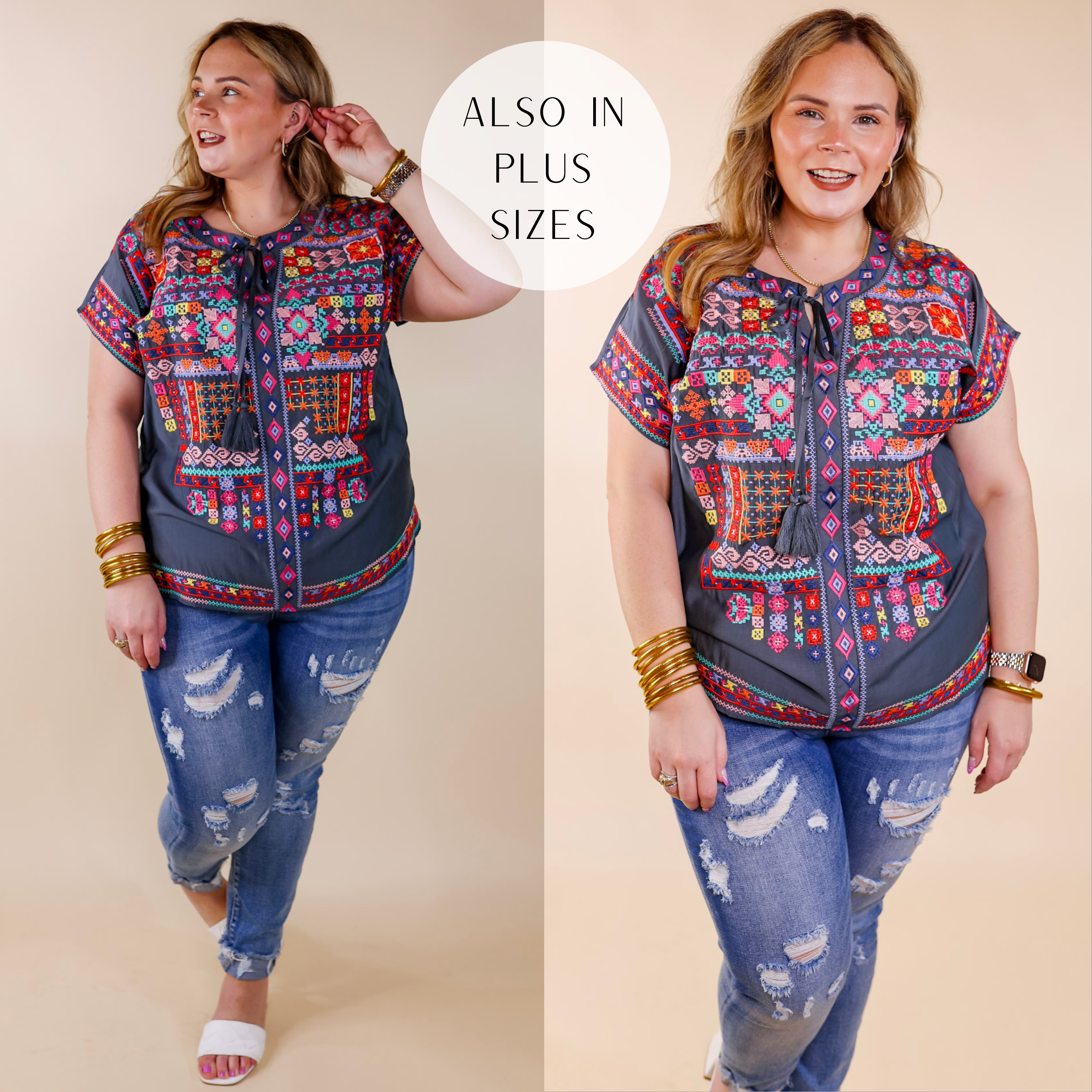 Model is wearing a grey short sleeve top with a keyhole neckline and colorful embroidery all over the front. Model has it paired with distressed skinny jeans, white heels, and gold jewelry.