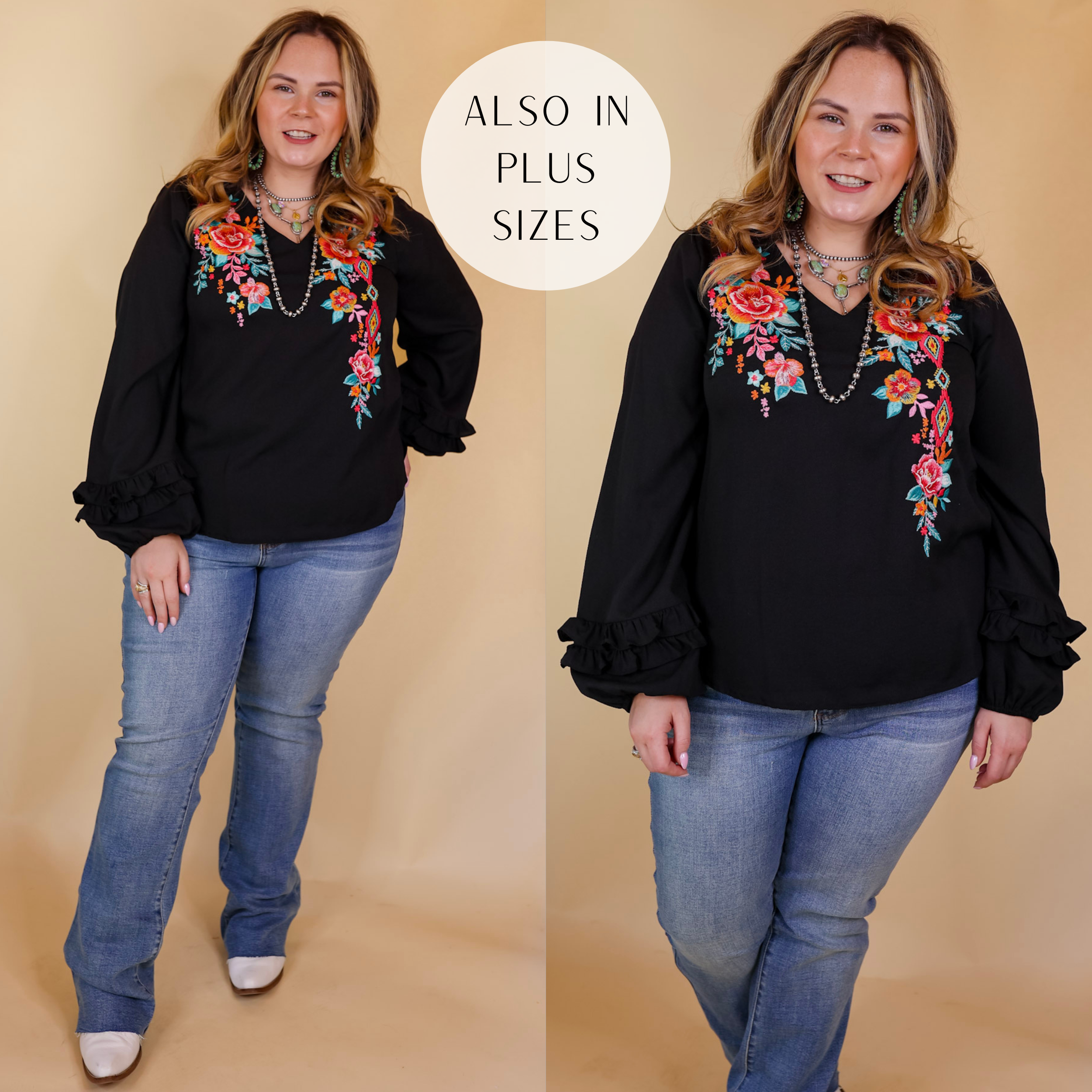 Model is wearing a long sleeve floral embroidered top with long sleeves that ruffle at the wrist in black. Model has this top paired jeans, boots, and Navajo jewelry. Background is solid tan. 