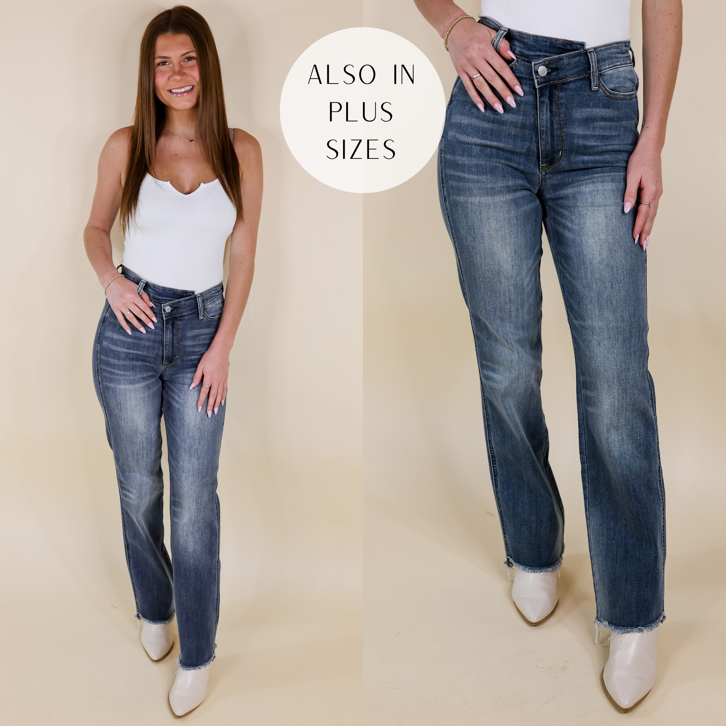 Model is wearing a pair of criss-cross waistband jeans with a straight leg and raw hem. Model has these medium wash jeans paired with a white tank top, ivory booties, and gold jewelry.