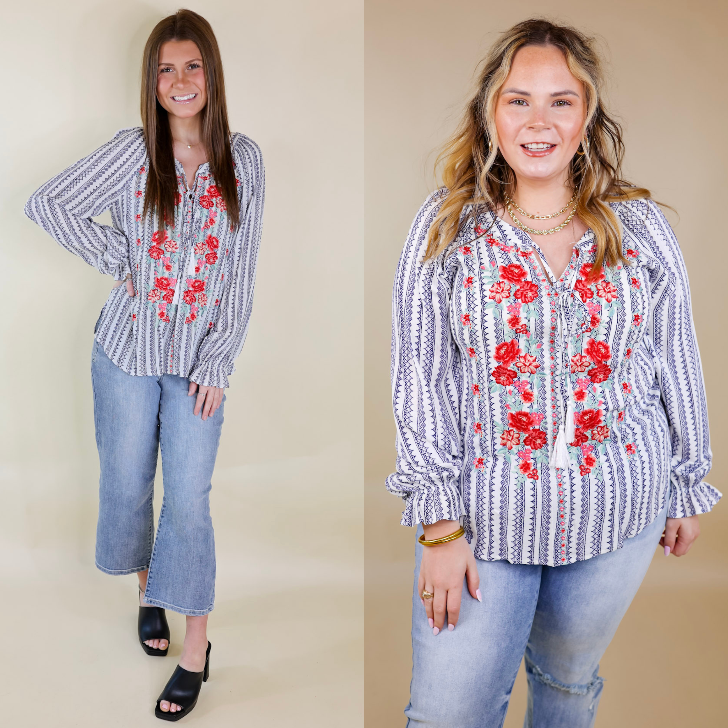 Models are wearing a navy and white striped top with long sleeves, a keyhole and tie neckline, and red floral embroidery. Size small model has it paired with cropped jeans, black heels, and gold jewelry. Size large model has it paired with distressed jeans and gold jewelry.
