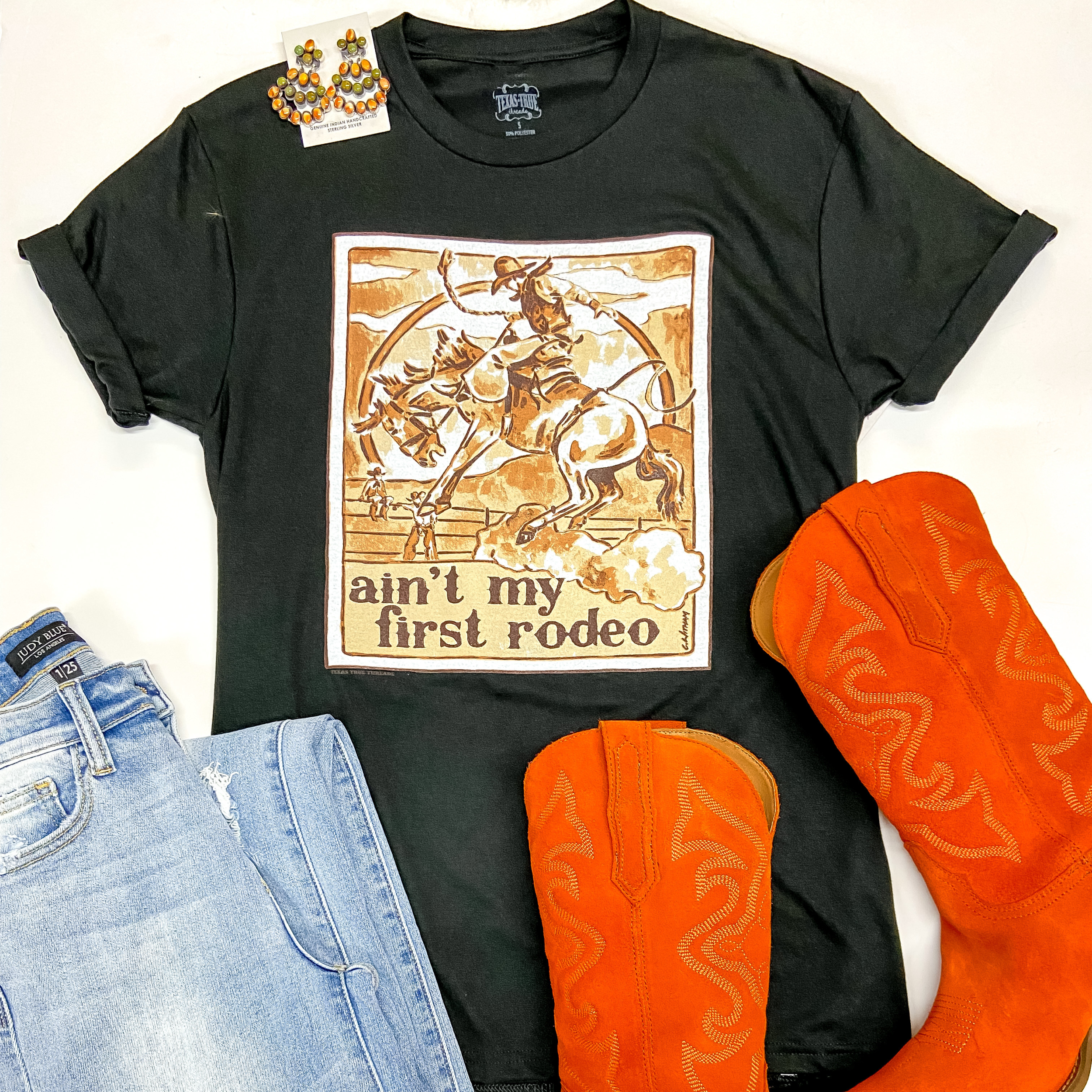 Ain't My First Rodeo Short Sleeve Graphic Tee in Black - Giddy Up Glamour Boutique