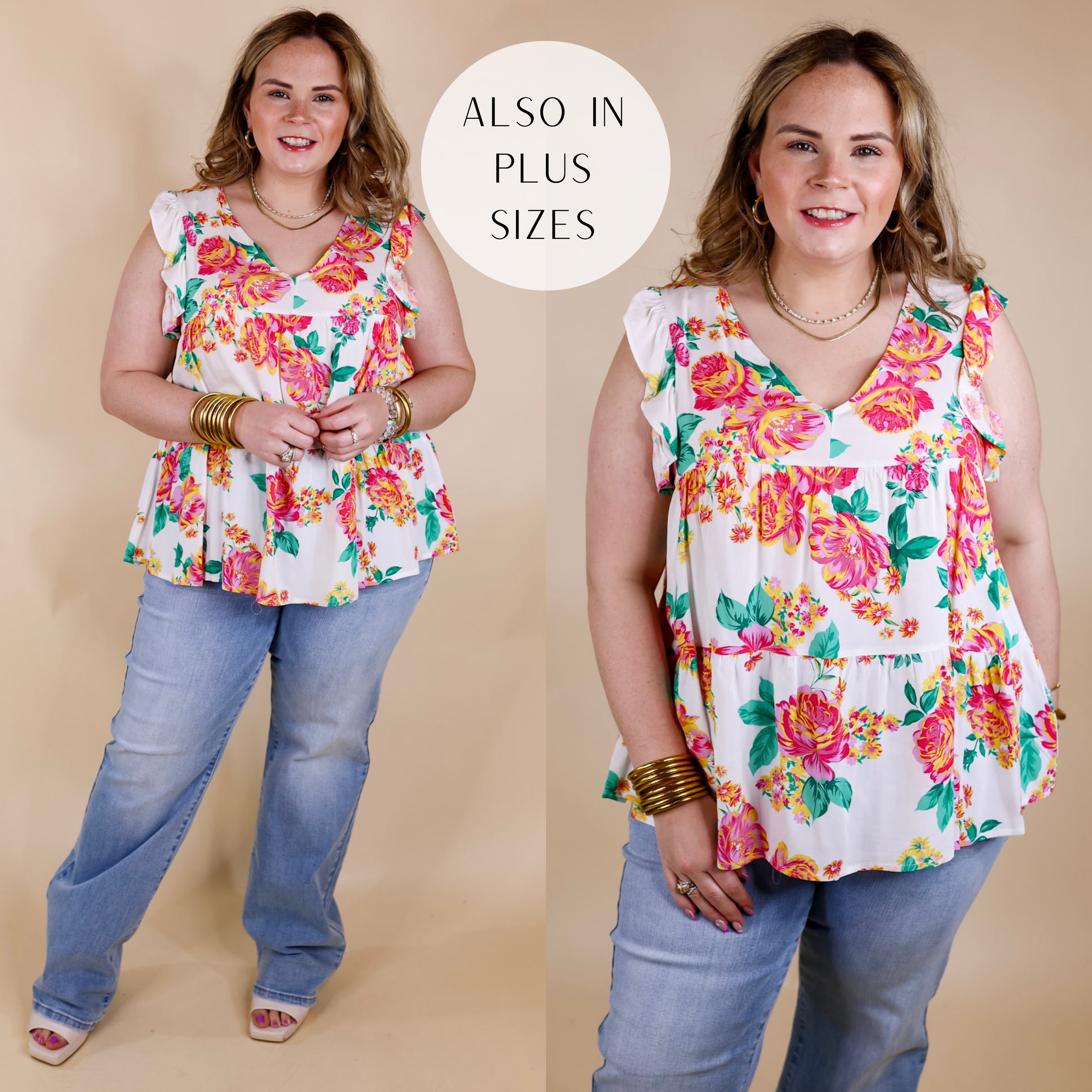 Model is wearing a white top with ruffle cap sleeves, v neckline, and yellow, green, and pink floral print. Model has this top paired with wide leg jeans, white heels, and gold jewelry.