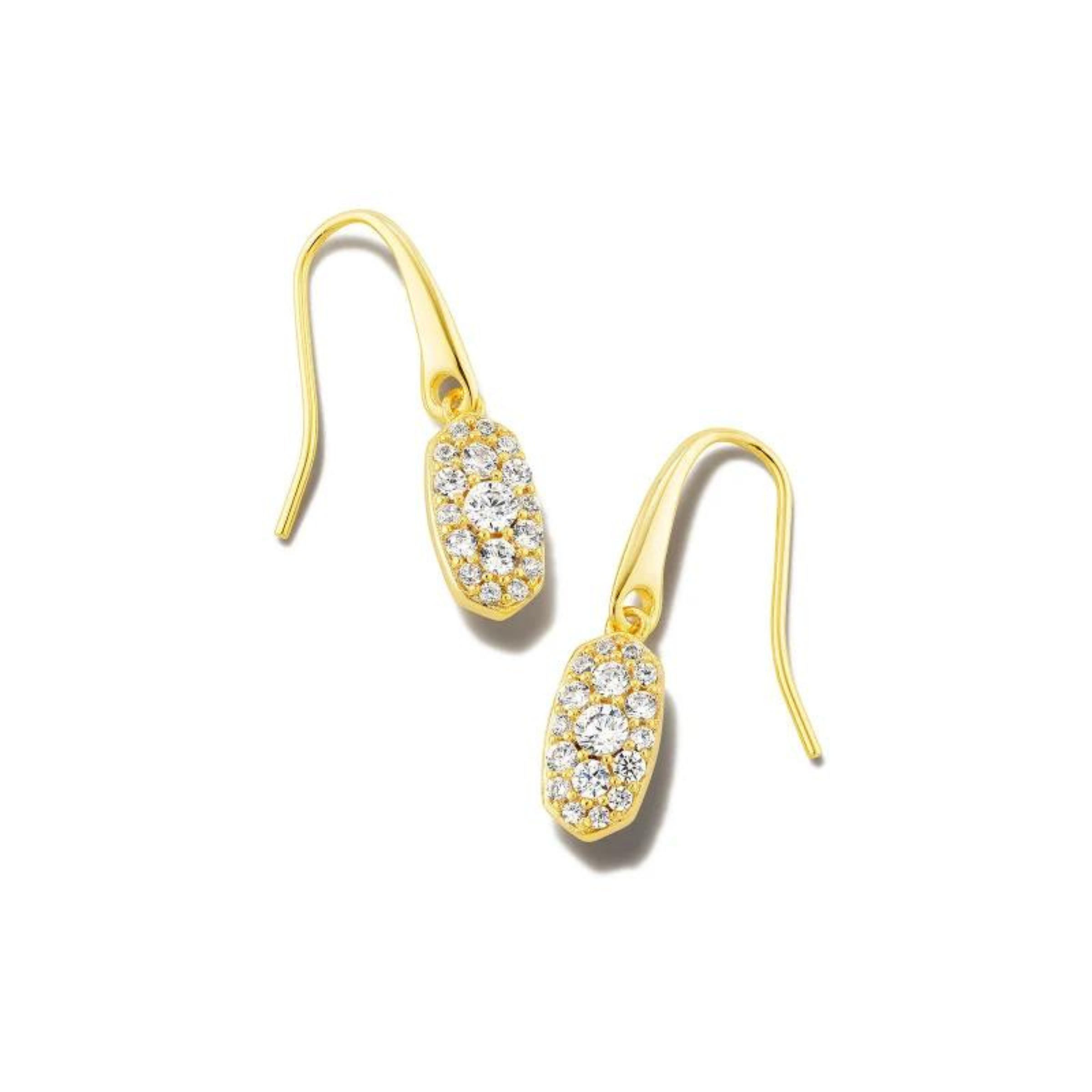 Gold, oval drop earrings with white crystals. These earrings are pictured on a white background. 