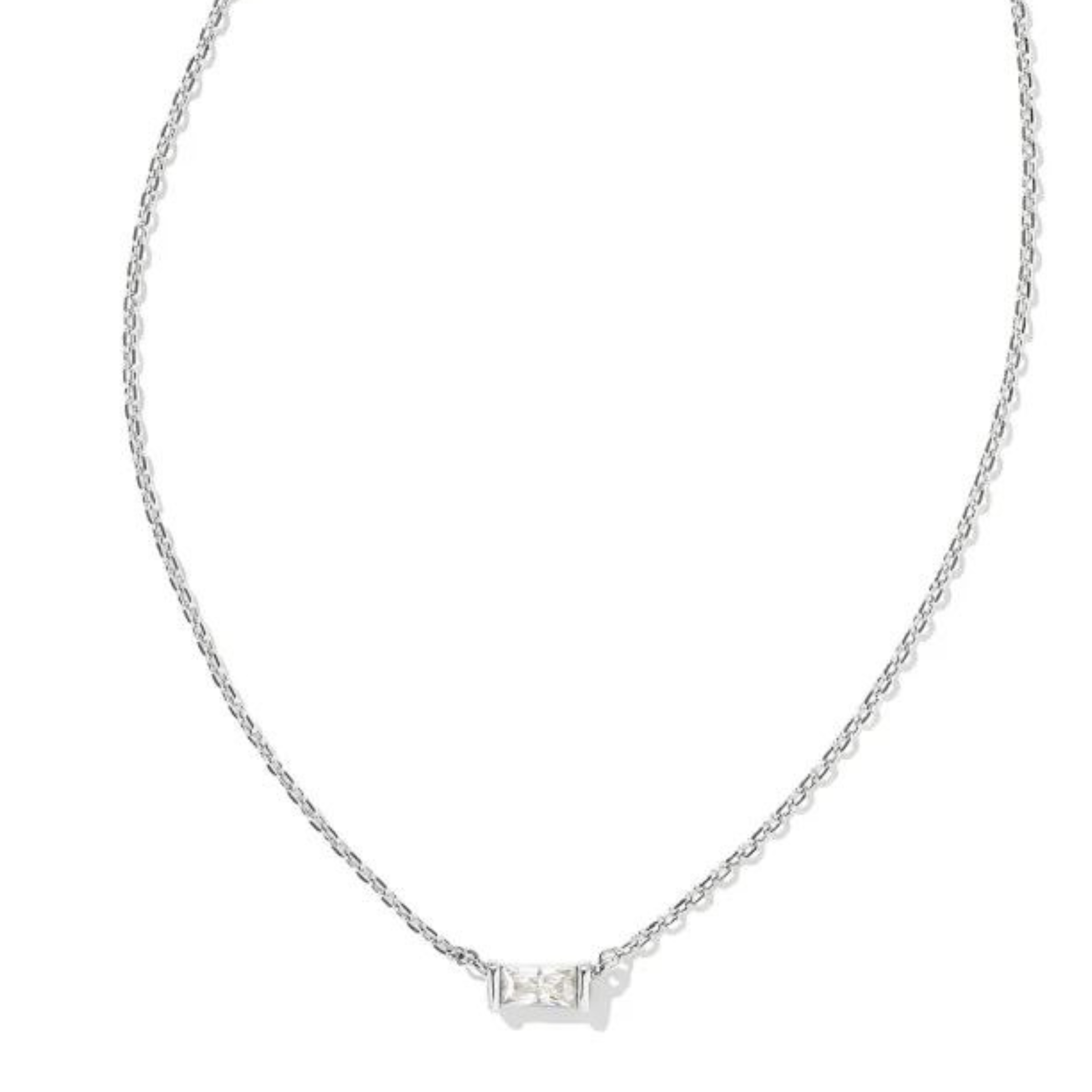 Silver chain necklace with a rectangle, clear crystal pendant. This necklace is pictured on a white background. 