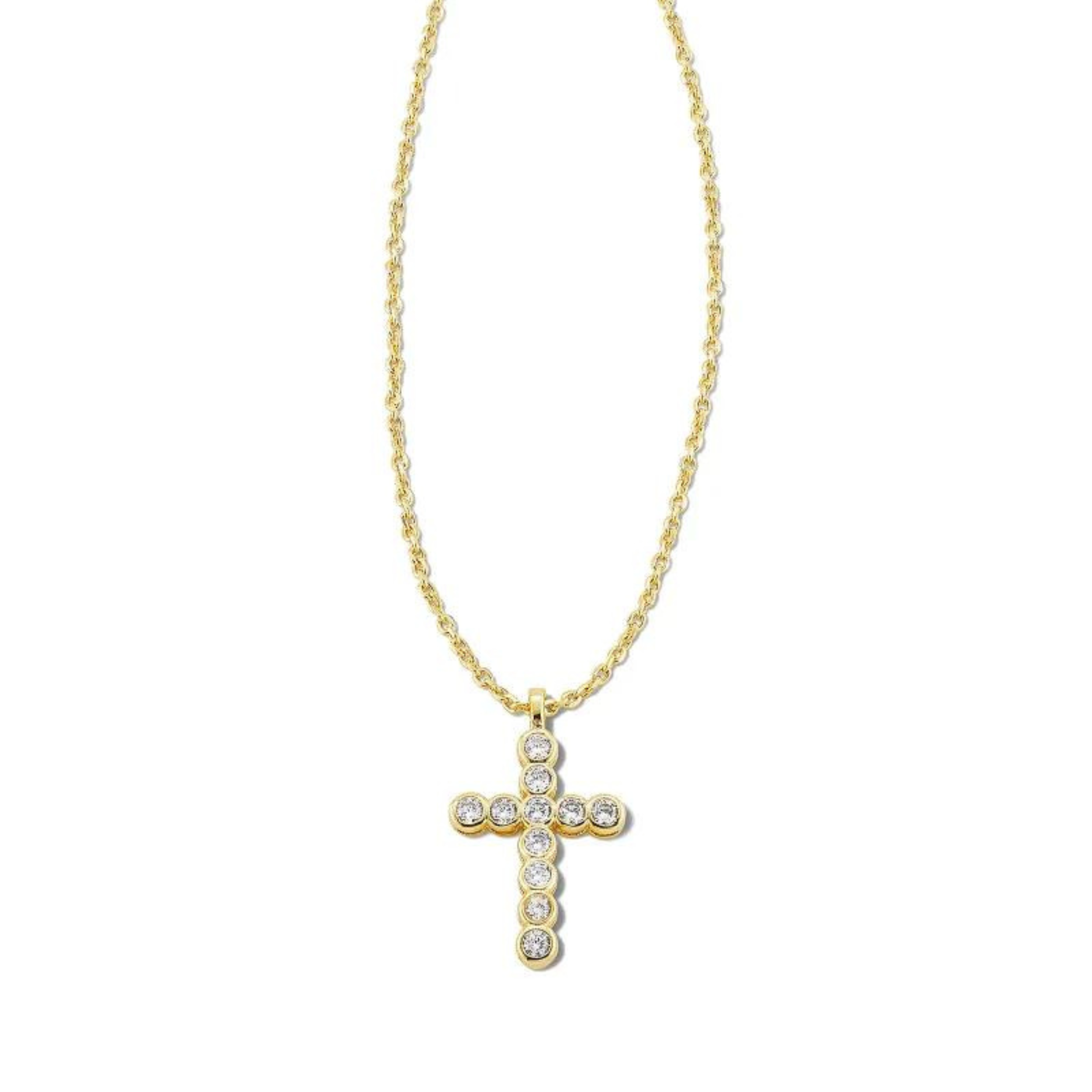 Gold necklace with cross pendant with white crystals, pictured on a white background.