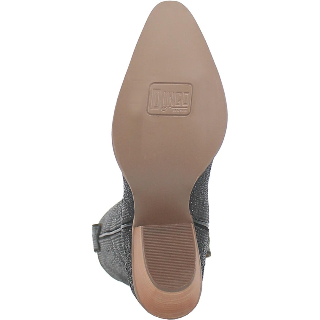 A mid calf length yellow cow print boot. Has a short heel, matching straps, a fur texture, and a V cut at the top. Item is pictured on a plain white background