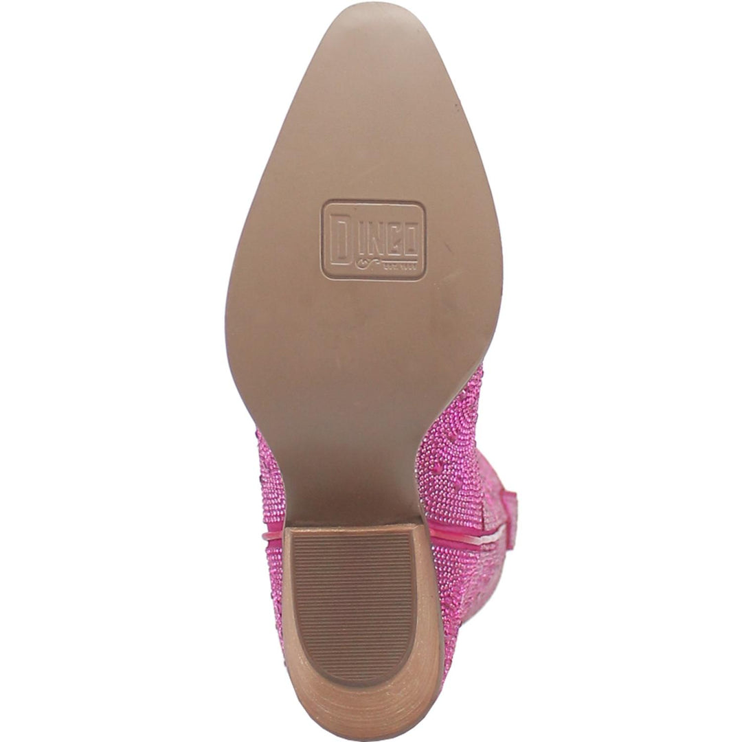 A mid calf length pink boot with rhinestones from top to bottom, matching leather straps, a short heel, and a V cut at the top. Item is pictured on a white background