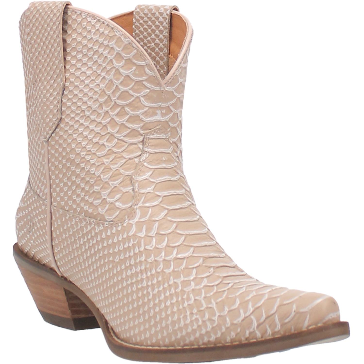 Small booties in a sand color with a reptile skin finish. Has a V cut at the top, a short heel, and matching leather straps. Item is pictured on a plain white background