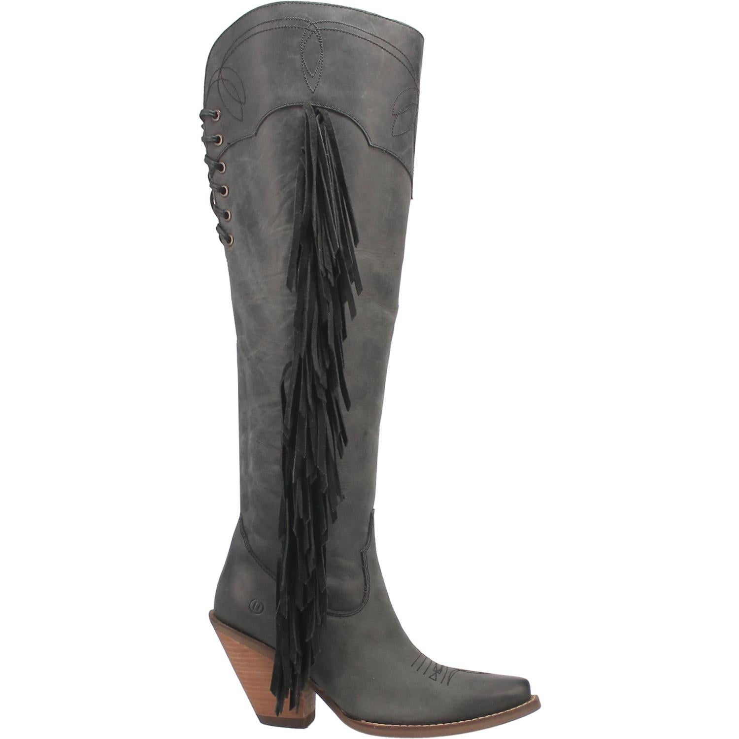 A tall black leather boot with a short heel, stitched desings at the top and bottom, lace up back, fringe down the right side, and a half zipper. Item is pictured on a plain white background