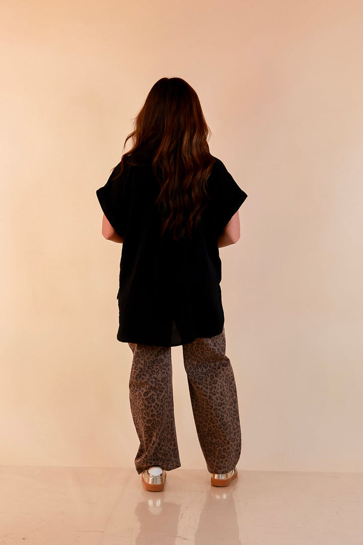 Timeless Appeal Woven Airflow Button Front Top with Rolled Cuff Short Sleeves and Front Pocket in Black