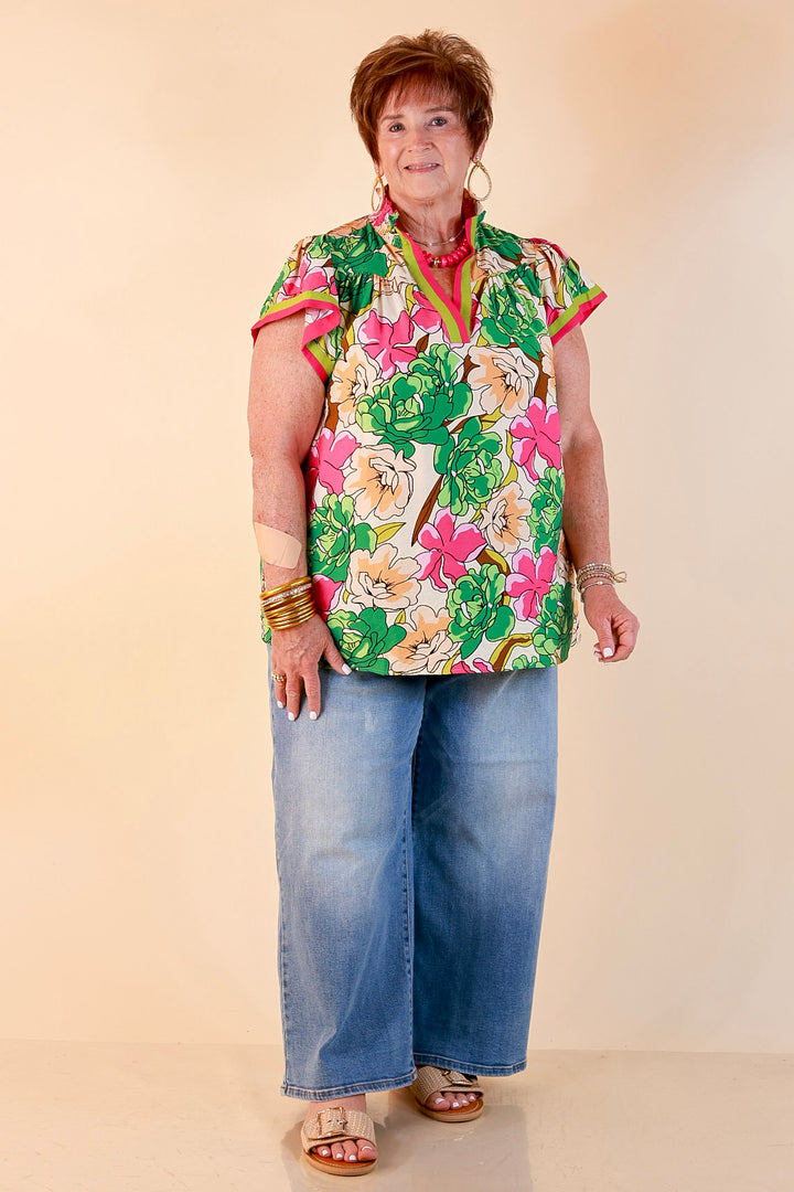 Spring Symphony Floral Print Flutter Sleeve Top with Contrast Trim Split Neckline in Pink and Green