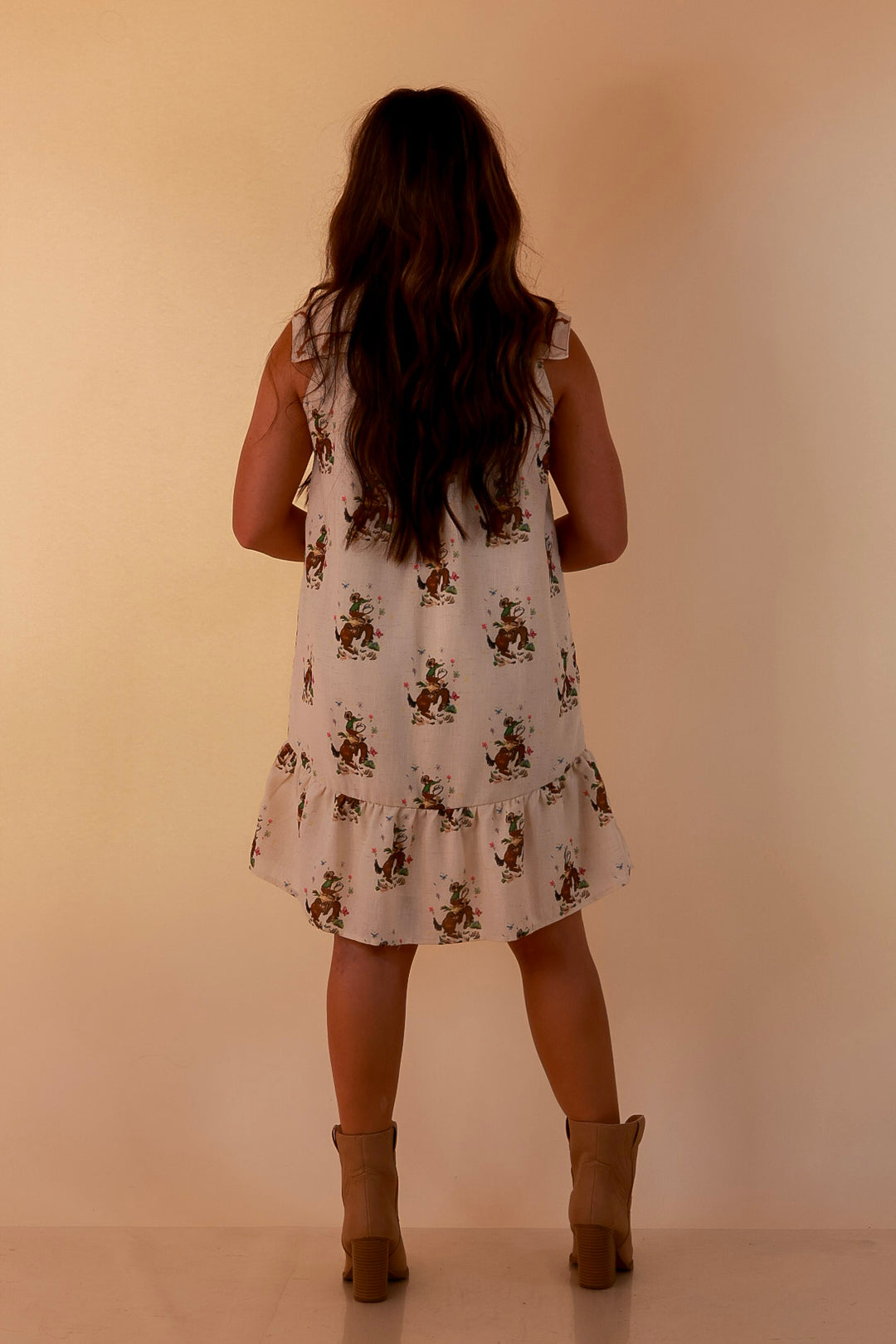 The Showstopper Sleeveless Pearl Snap Bronc Print Ruffle Dress with Sailor Collar and Horseshoe Embroidery in Cream