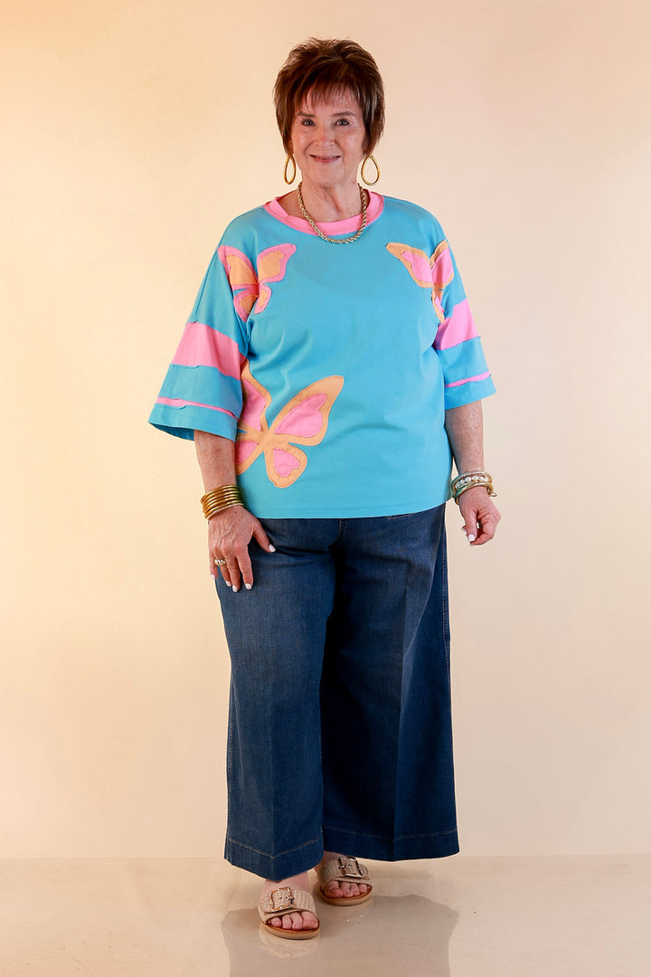 Dream in Color Butterfly Print Relaxed Short Sleeve Top with Contrast Sleeves in Turquoise Blue