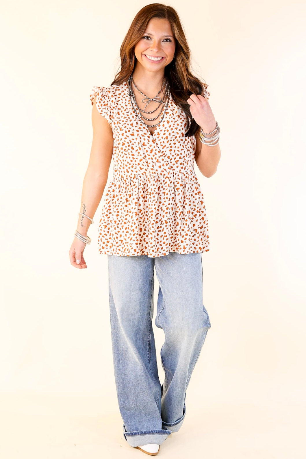 Tour The Town Dotted Ruffle Cap Sleeve Babydoll Top in Ivory