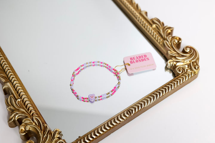 GUG Exclusive by Beaded Blondes | Valentines Day Kiss Me Conversation Heart on Hot Pink and Lilac Sprinkle