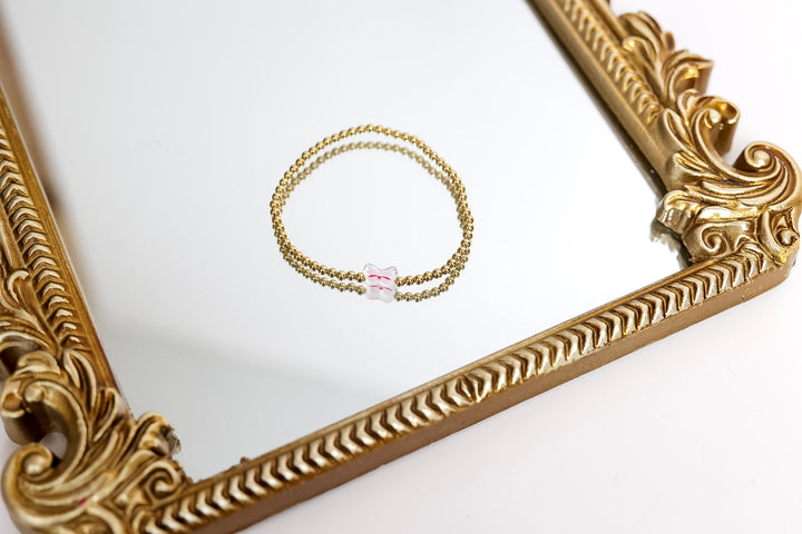 Beaded Blondes | Gold Beaded Bracelet with Pink Bow Charm