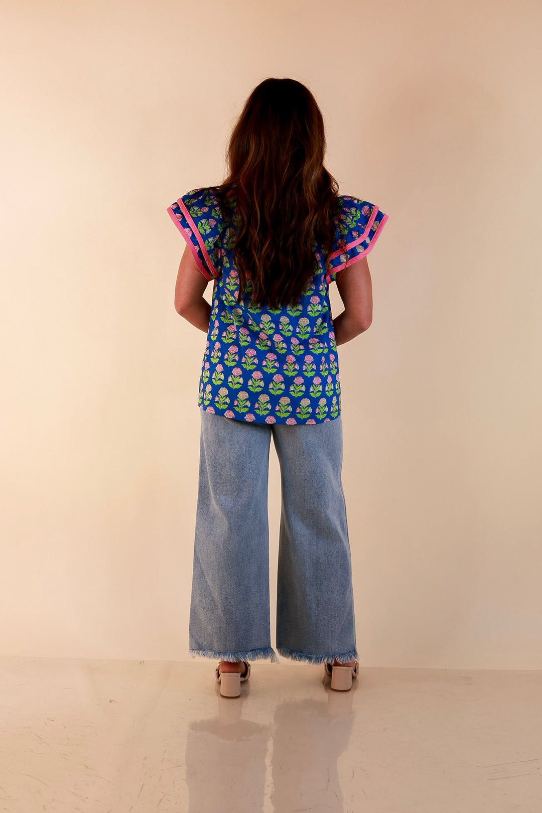 Fresh Perspective V Neck Floral Print Top with Ruffle Cap Flutter Sleeves and Contrast Trim in Royal Blue