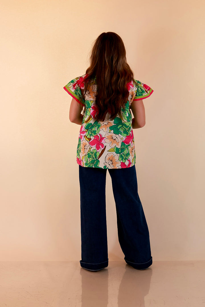 Spring Symphony Floral Print Flutter Sleeve Top with Contrast Trim Split Neckline in Pink and Green