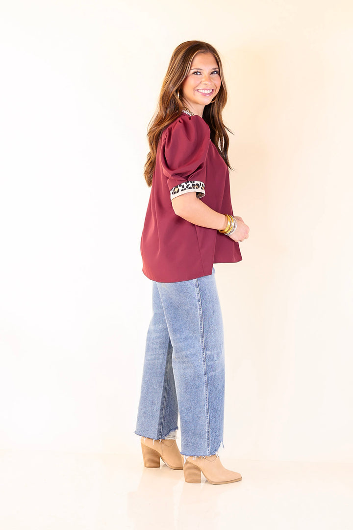 Standout Style V Neck Top with Short Balloon Sleeves and Leopard Print Trim in Maroon