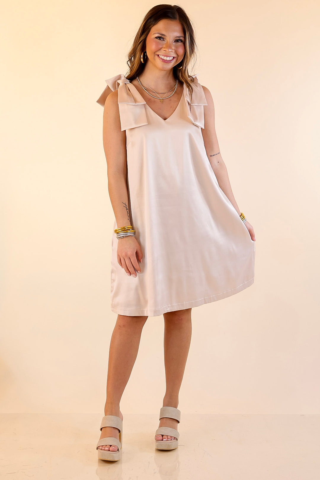 Satin Soirée V Neck Mini Dress with Bow Strap Detailing in Champagne