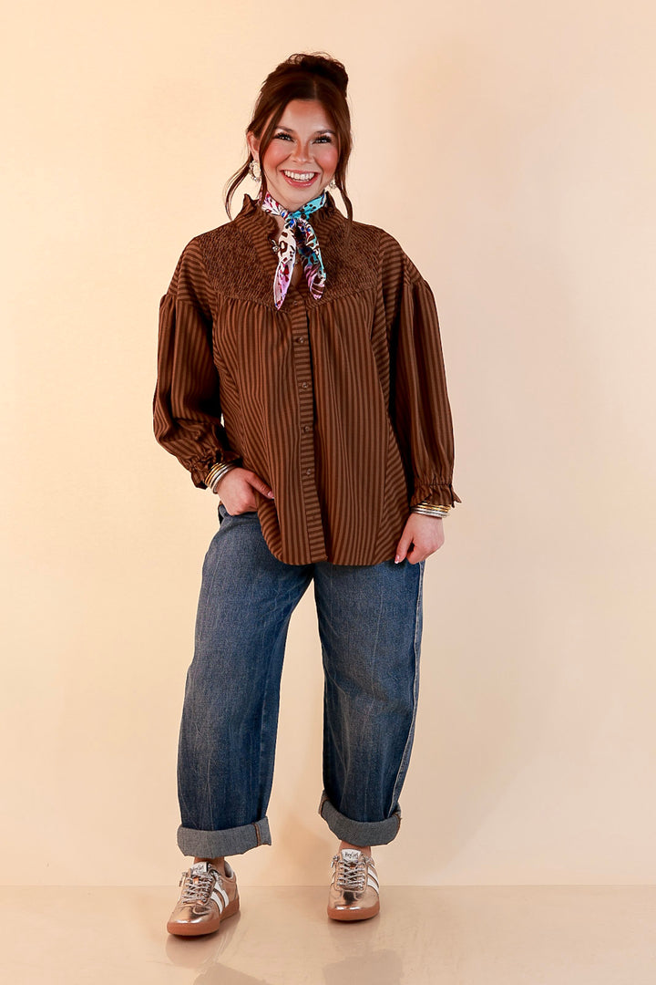 A Fine Line Smocked Ruffle Neck Long Sleeve Striped Button Front Blouse in Chocolate Brown