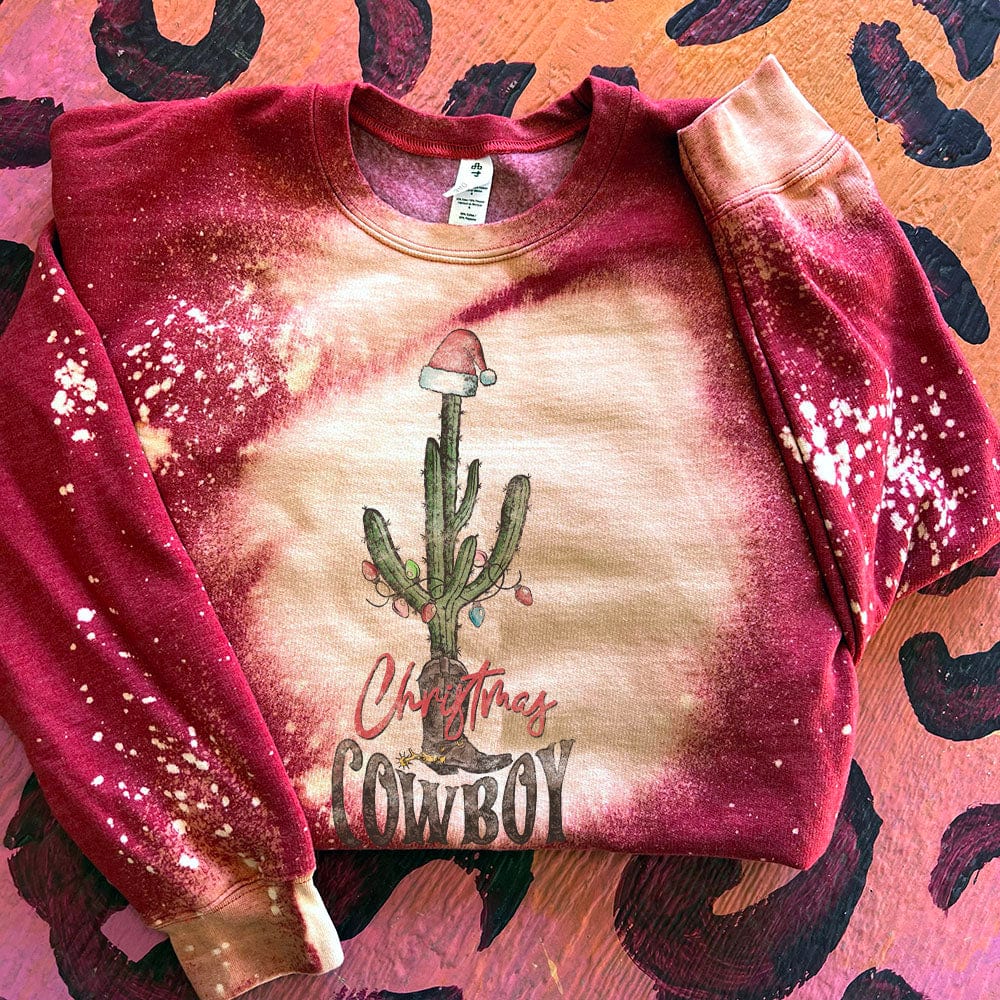 Online Exclusive | Christmas Cowboy Long Sleeve Graphic Sweatshirt in Splatter Bleach Red - Giddy Up Glamour Boutique