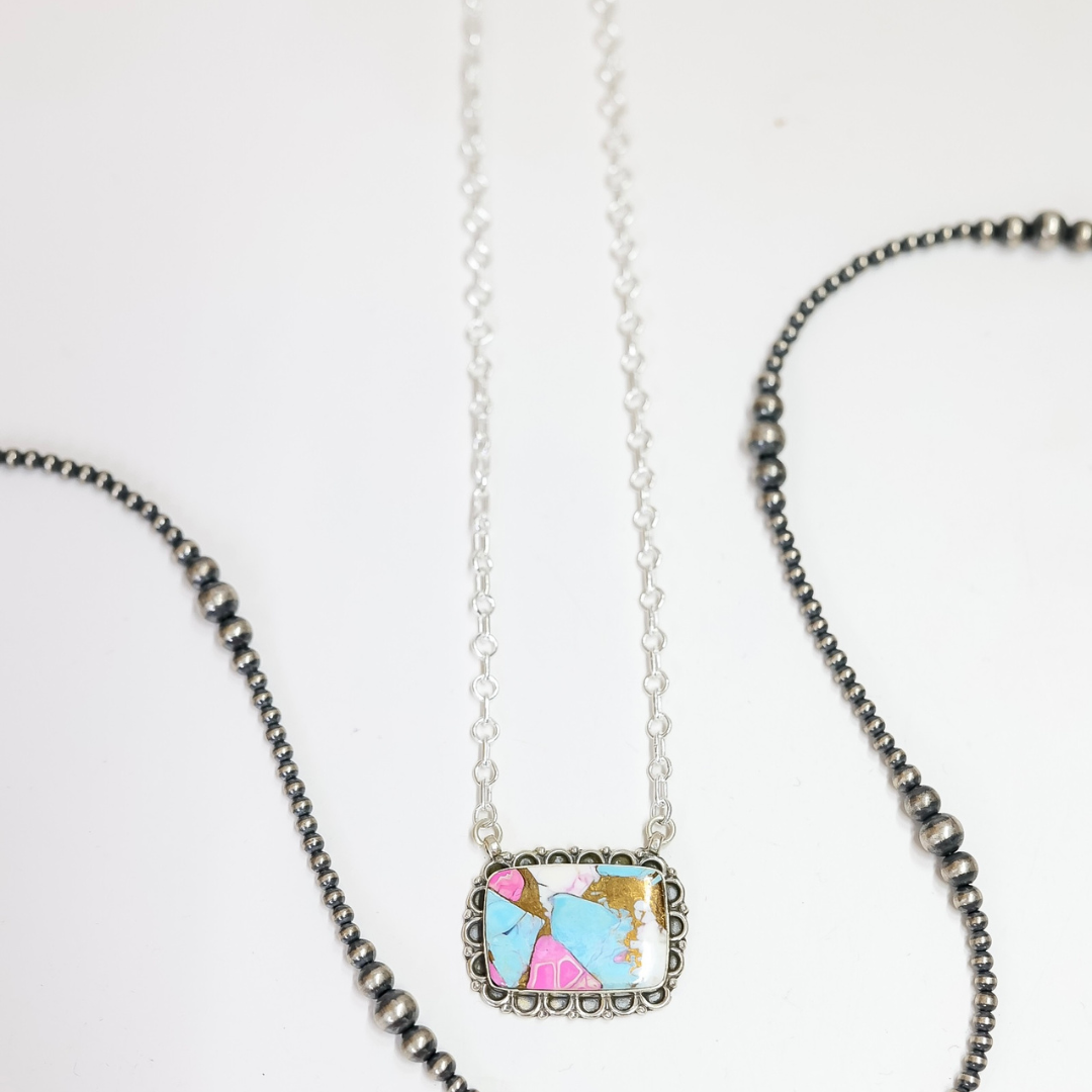Necklace with a colorful pendant on a white background