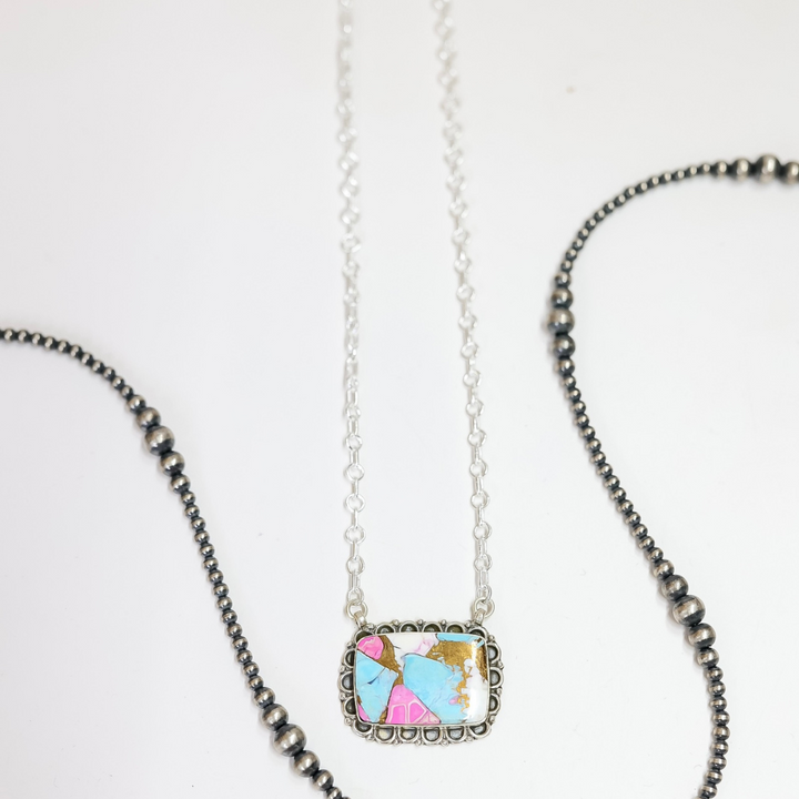 Necklace with a colorful pendant on a white background